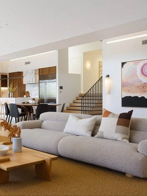 Our clients wanted their light to feature the architecture, introduce texture to the interior from the garden, and provide a soft, comforting light throughout the home.

So, we created indirect light from numerous fittings to reflect the varying volu