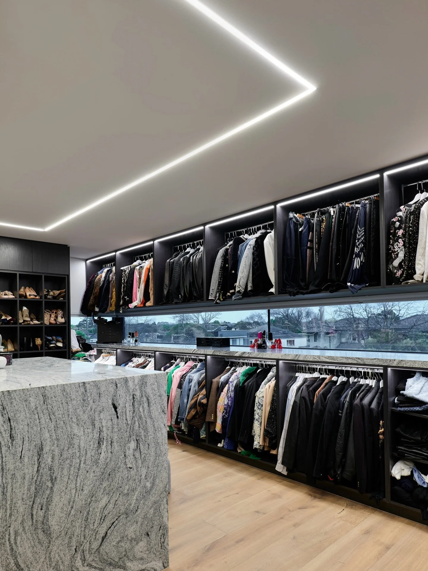 In our Glass House project&rsquo;s amazing Dressing Room, we used linear in both the ceiling, surrounding the stunning island and in the joinery above each hanging section to ensure our clients can see into every corner of this room, with all clothin