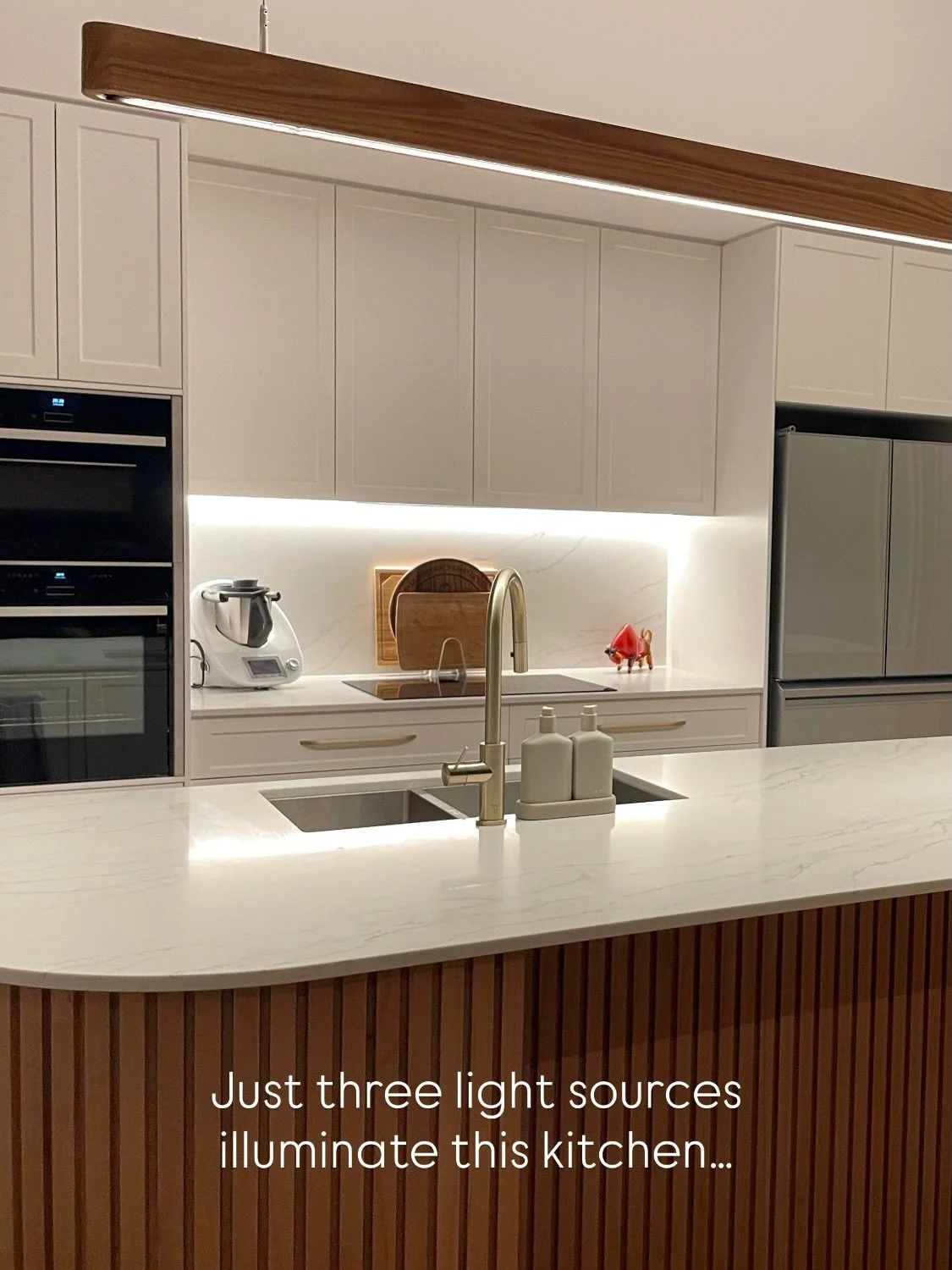 Yet, as you can see, they provide ample functional lighting while offering a soft ambient glow when the kitchen is not in use.

While every kitchen needs a unique design, this one perfectly demonstrates how effective layered lighting can be. It shows