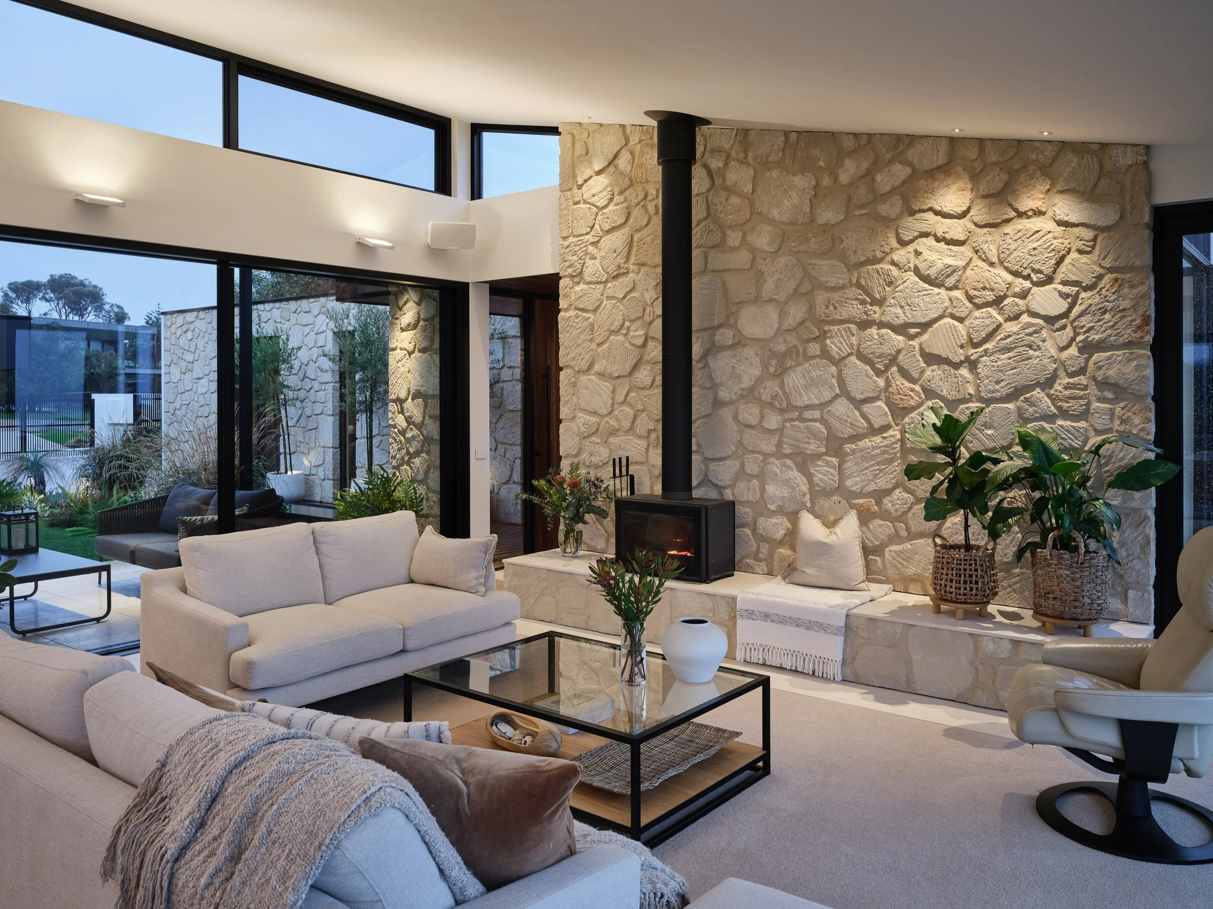 Modern living room with neutral colour palette and warm lighting