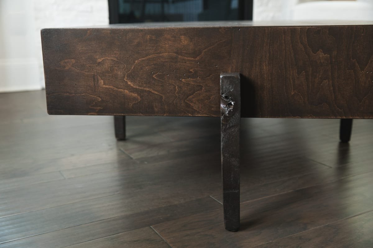 dark-wood-coffee-table-50x30x16-side-view-leg.jpeg