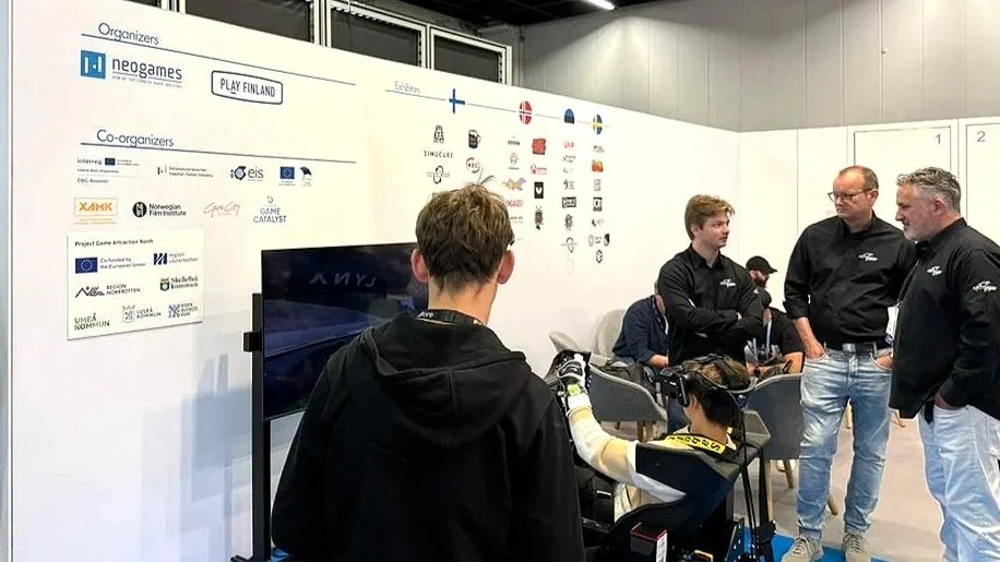 People at the Nordic All Stars Gamescom booth.
