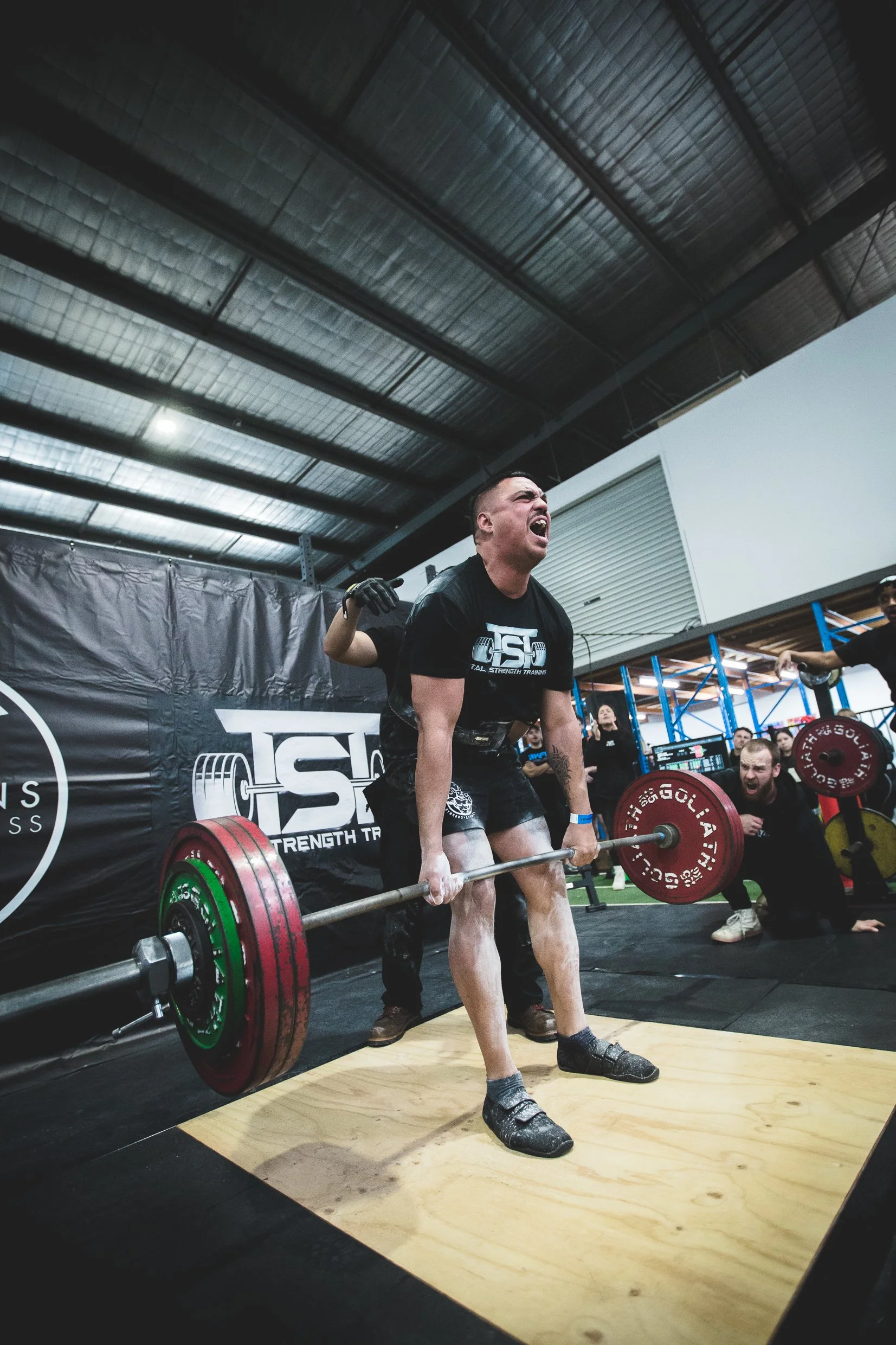 Man lifting deadlift in novice powerlifting comp east melbourne suburbs