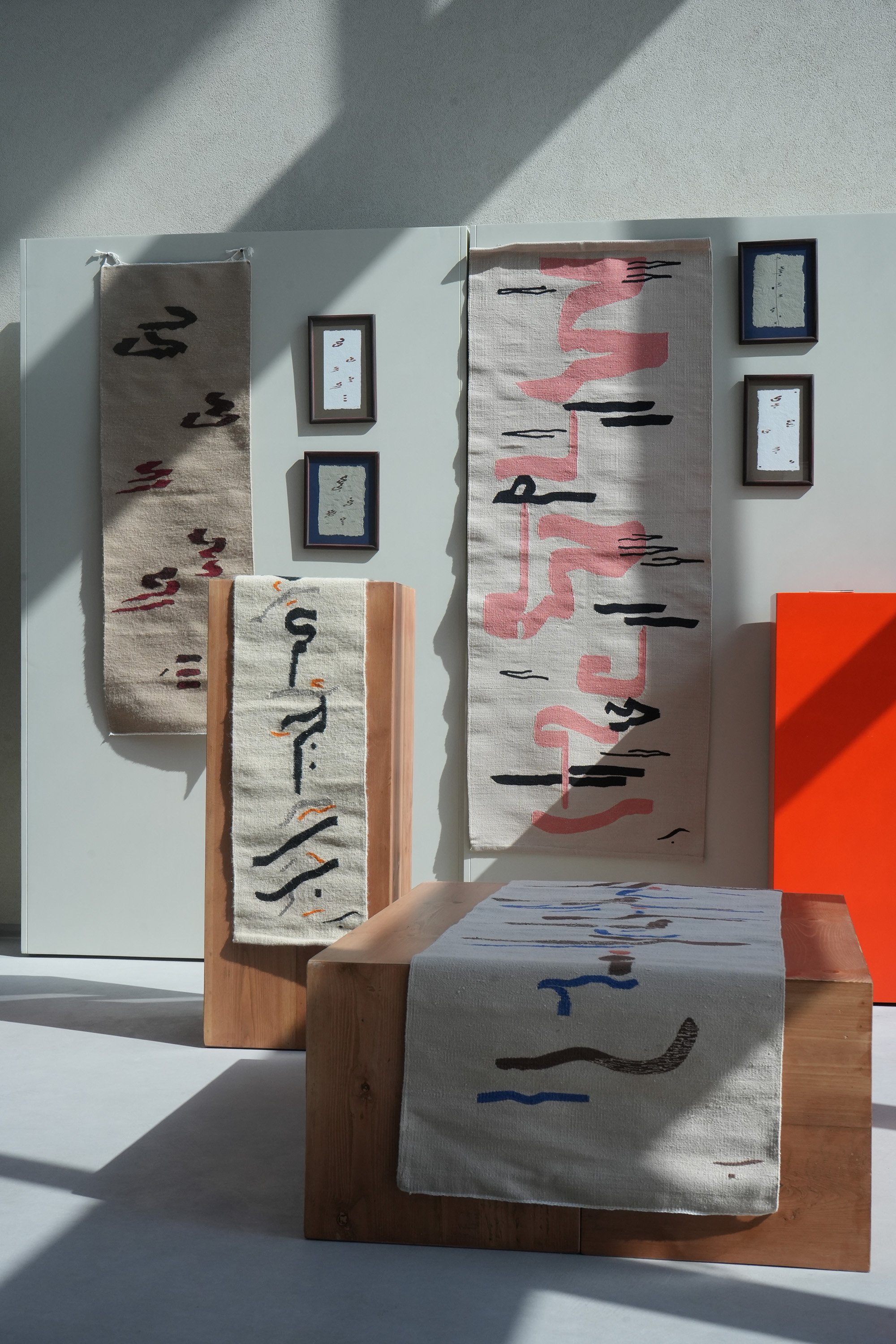 Handwoven wall-hangings on display