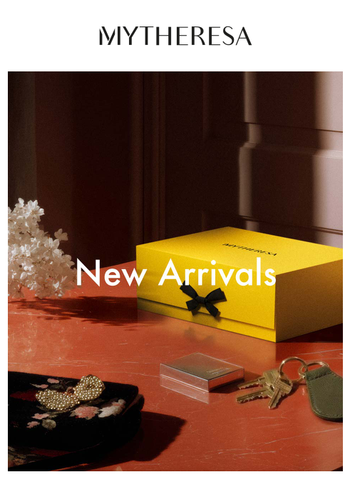 AI Artist Berlin- Advertising campaign image with a yellow box on a red table and decorative table top accessories in a female style.