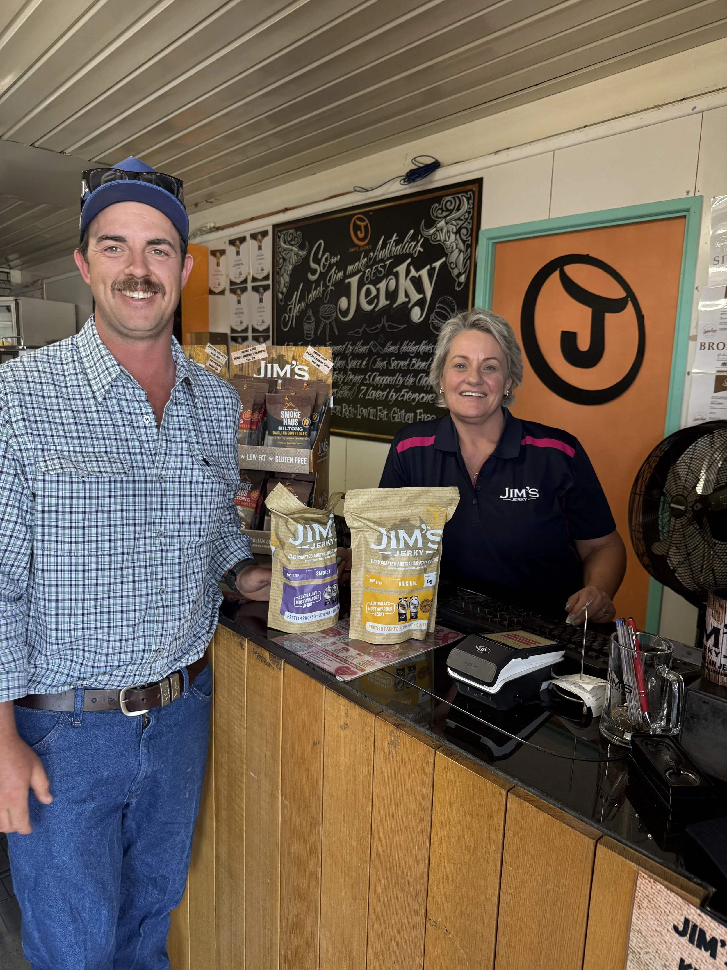 Joe Hennessy at counter Jims Jerky.jpeg