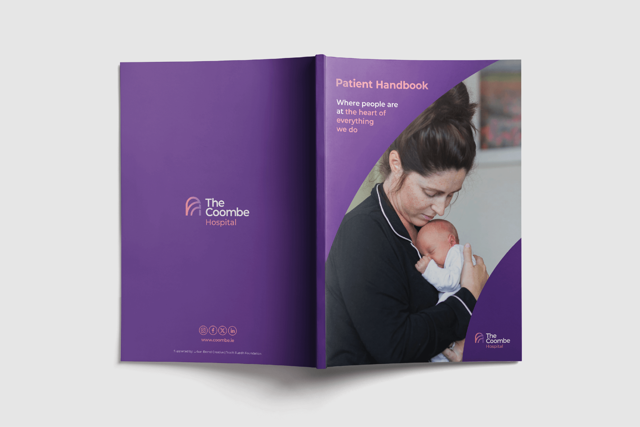 Open brochure for The Coombe Hospital with a cover showing a woman holding a newborn baby, purple-themed design, and hospital logo.