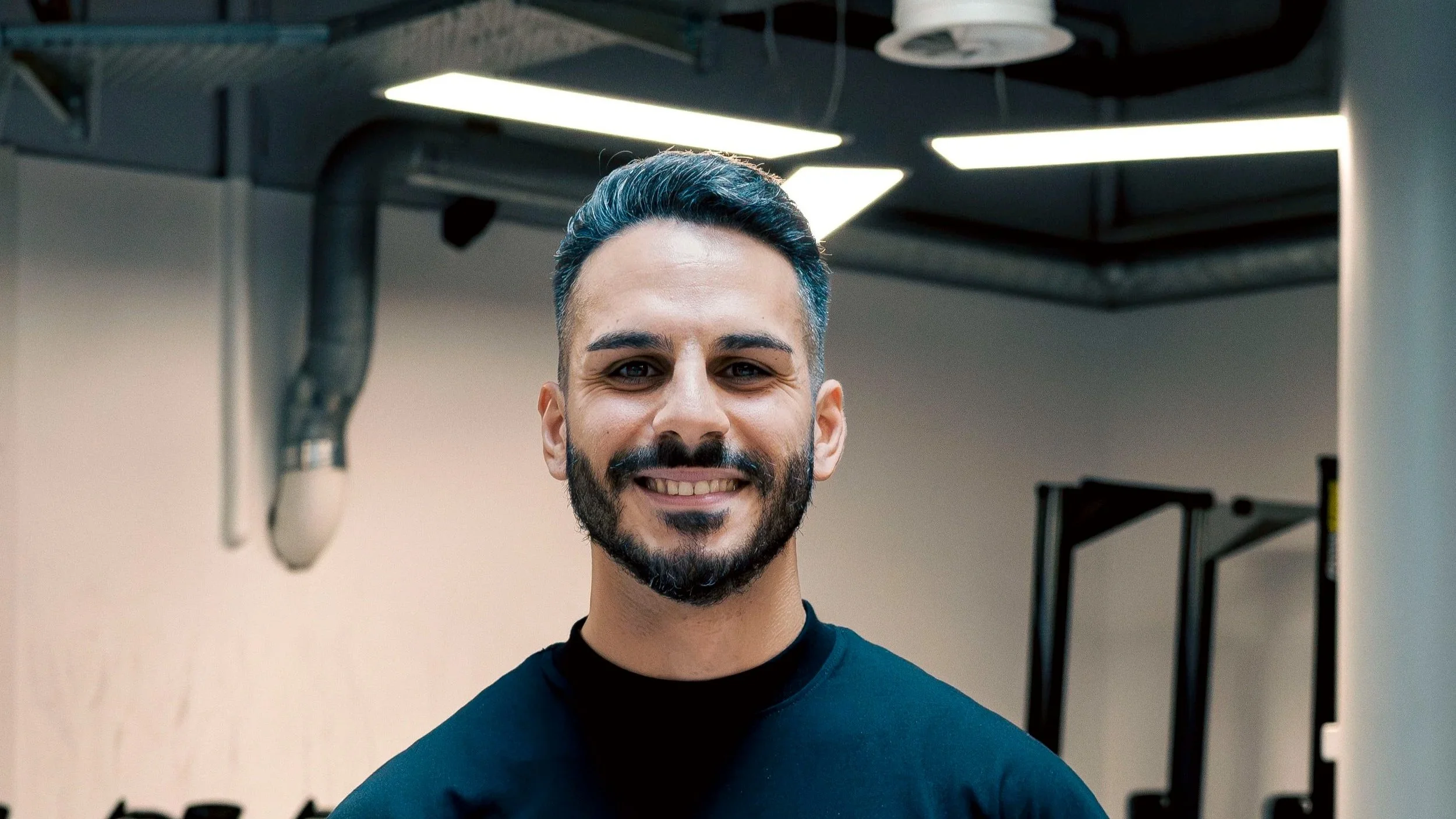 Personal trainer à Lausanne aidant ses clients à développer force, mobilité et énergie avec des exercices fonctionnels.