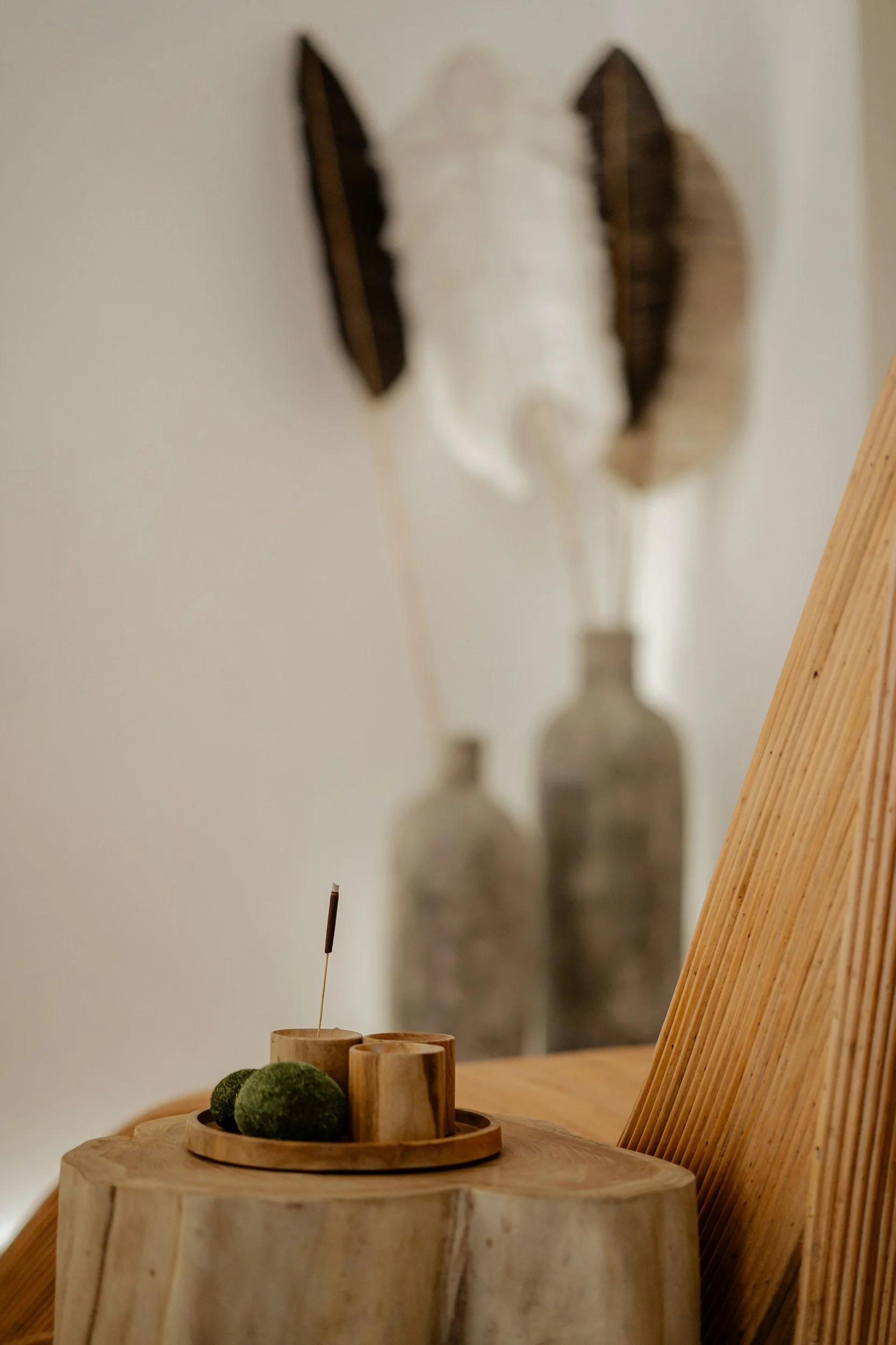 Calm neutral interior with soft decor, representing a safe and grounding environment for therapy and emotional regulation