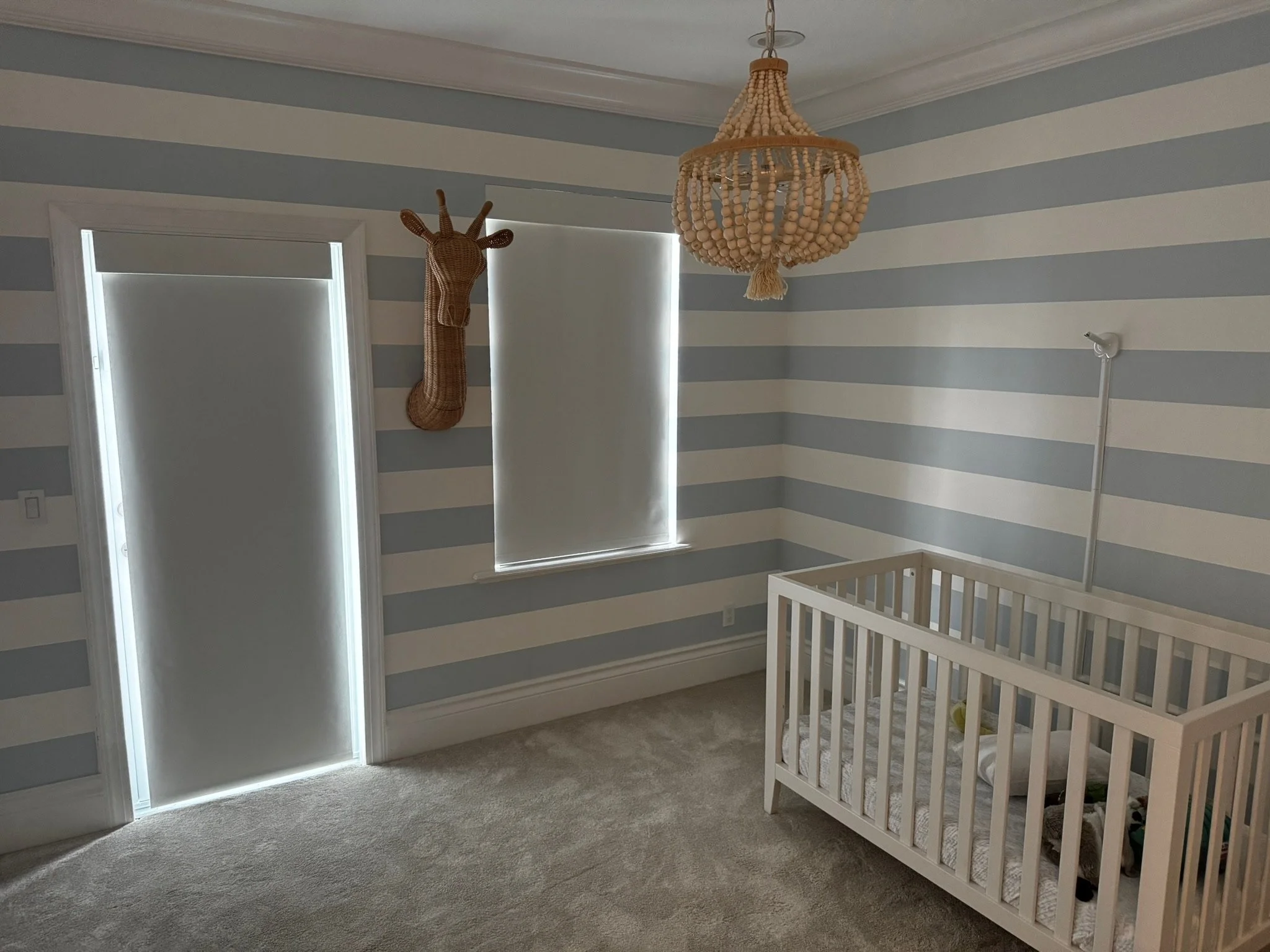 Custom nursery shades for privacy and light control.