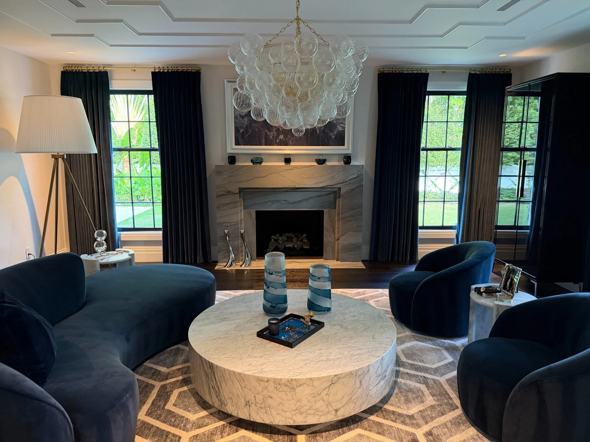 Dark drapery panels framing a formal living room.
