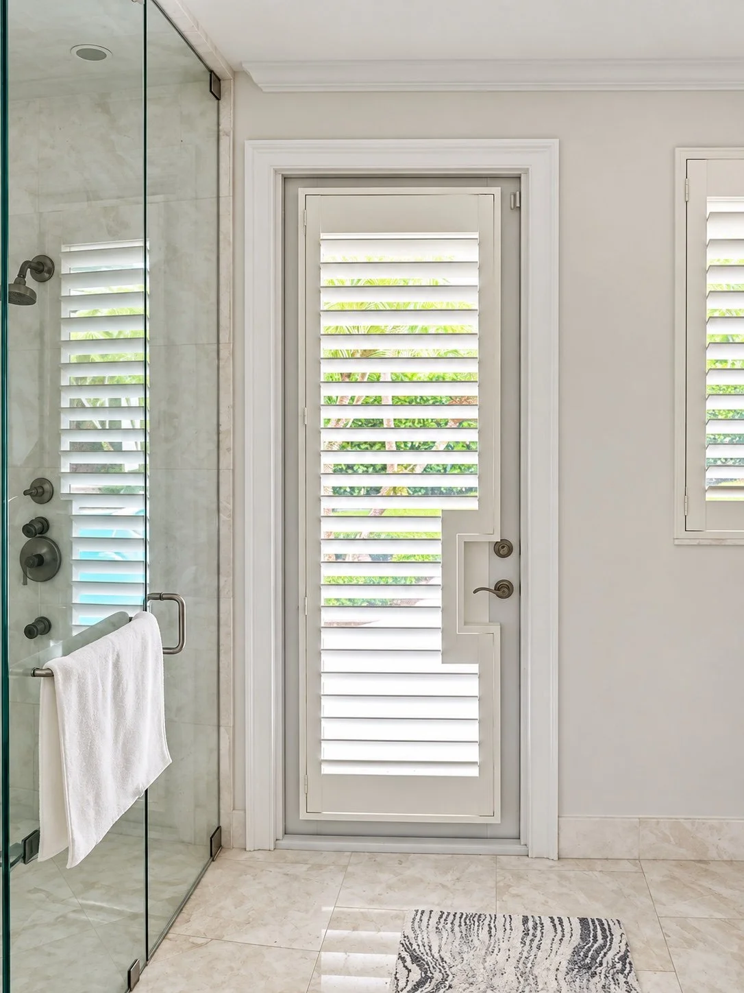 Custom plantation shutters fitted to a bathroom door