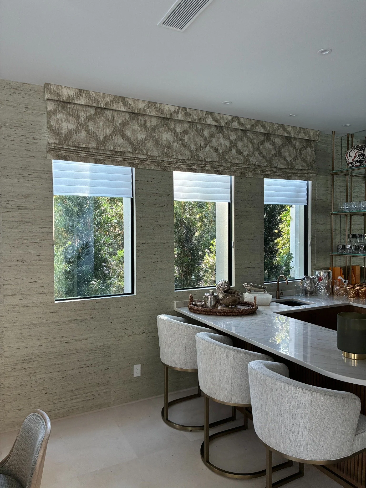 Shades fitted above a row of bathroom windows.