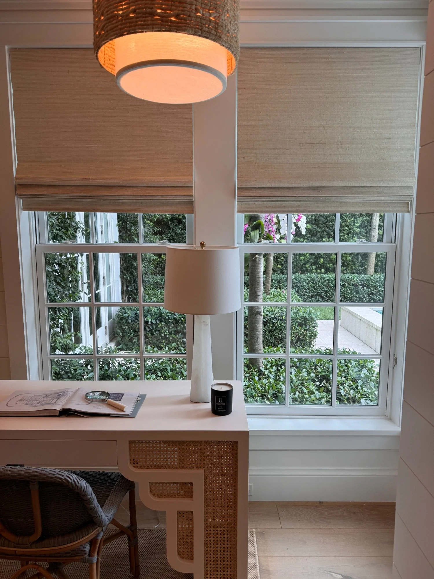 Neutral Roman shades tailored to home office windows