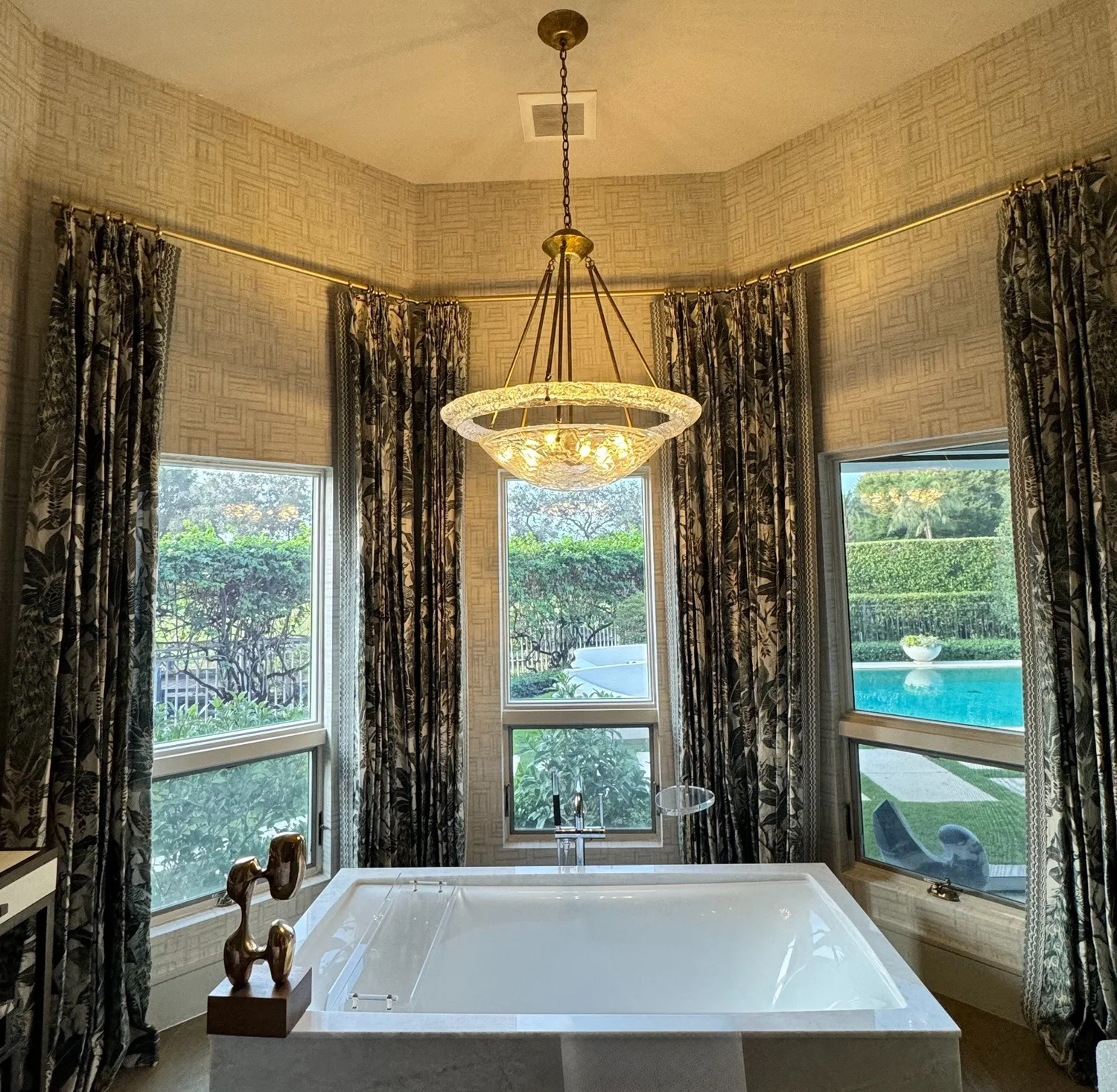 Patterned drapery surrounding a freestanding bathtub