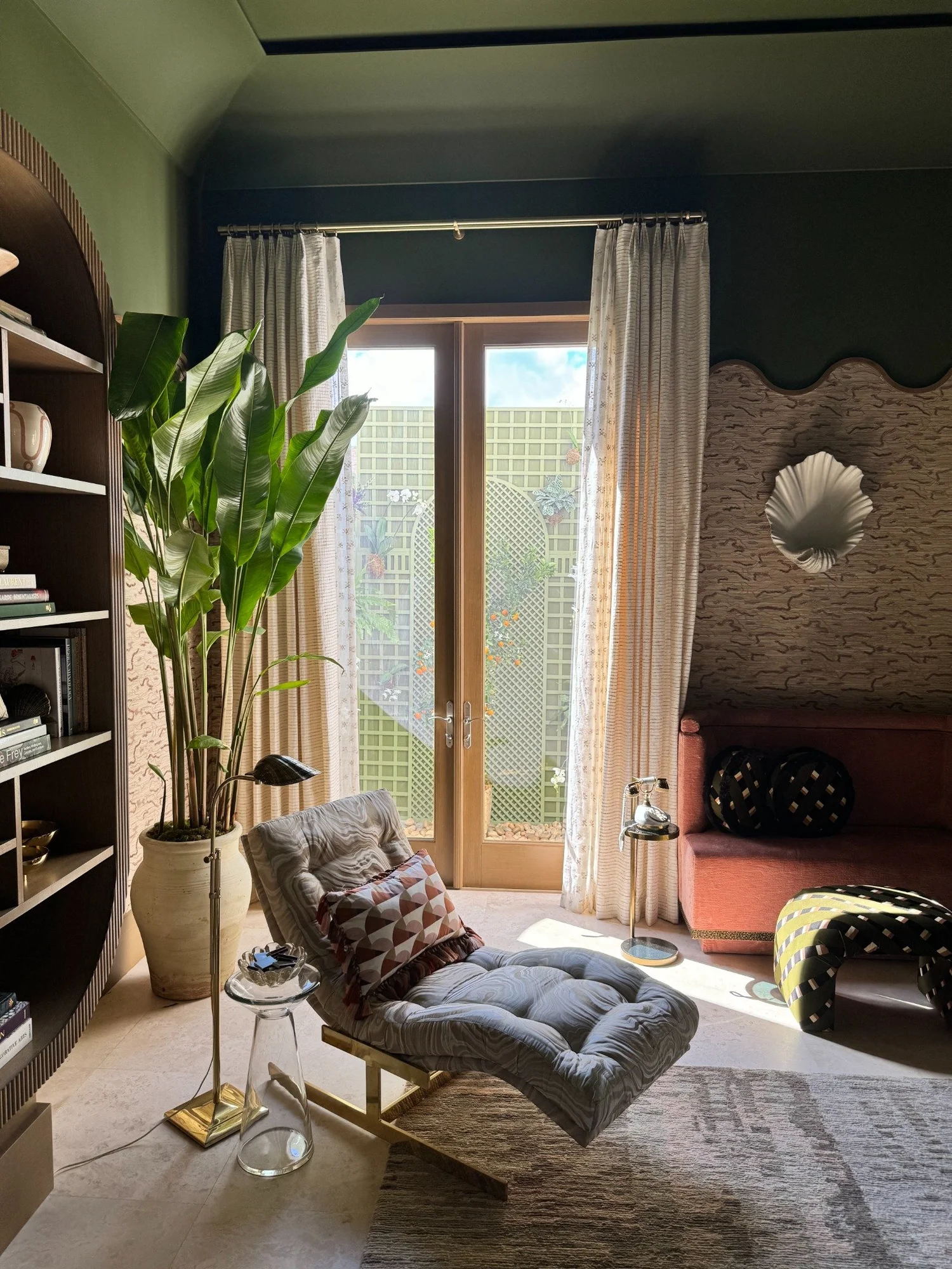 Soft drapery panels adding contrast to a dark reading room