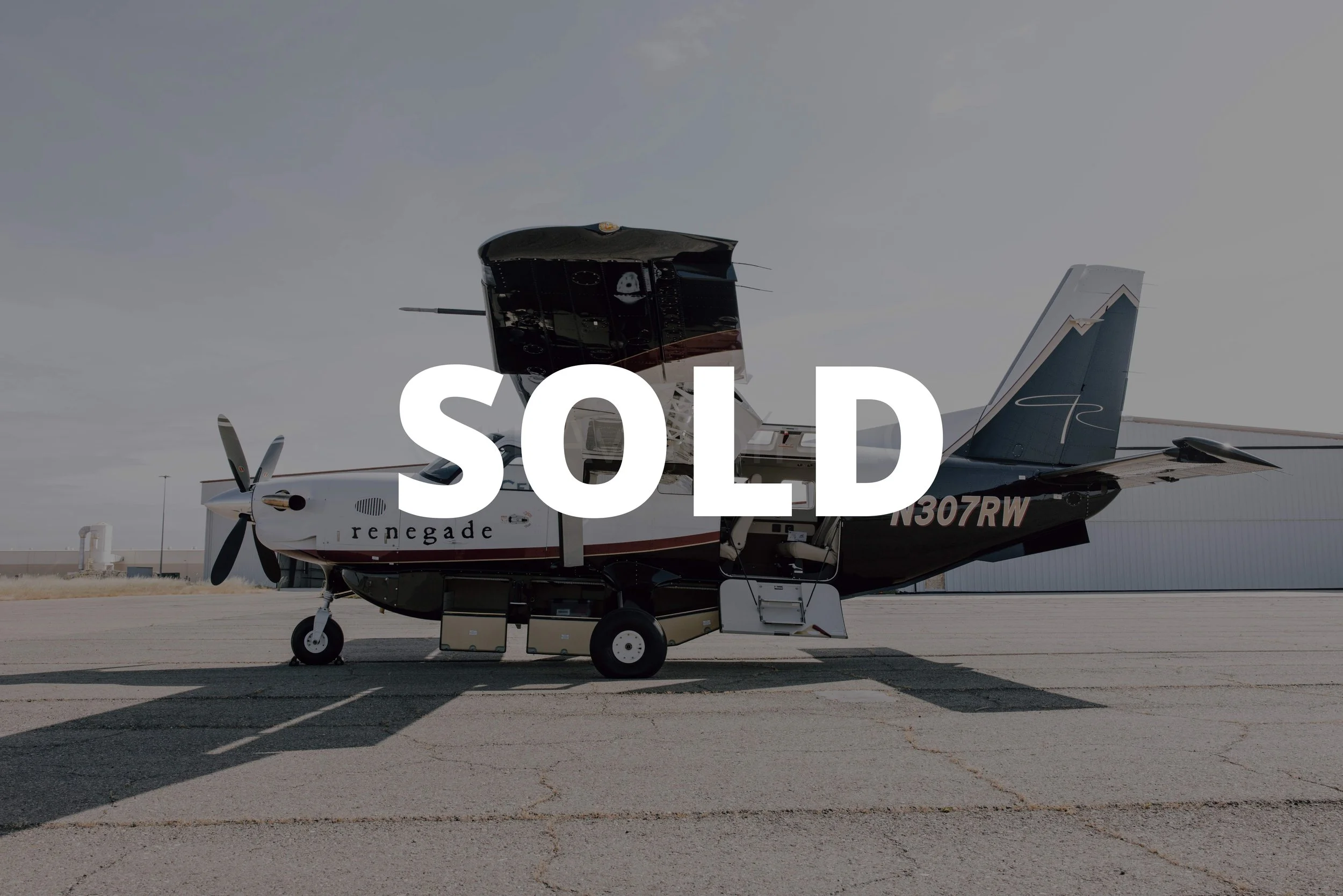 A 2017 Daher Kodiak 100 aircraft with a custom paint scheme and a large 'Sold' banner.
