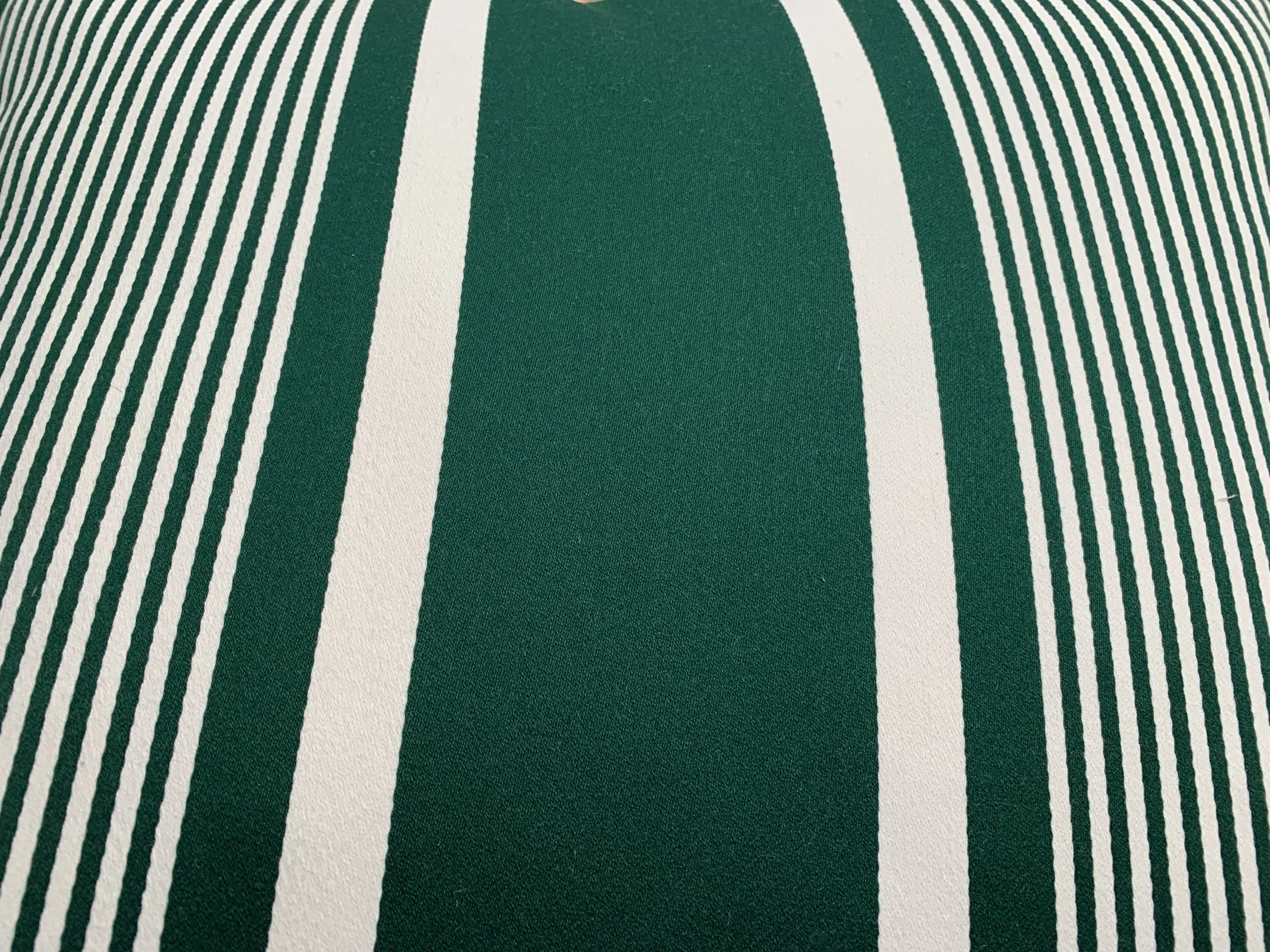 Close-up of green fabric with white parallel stripes