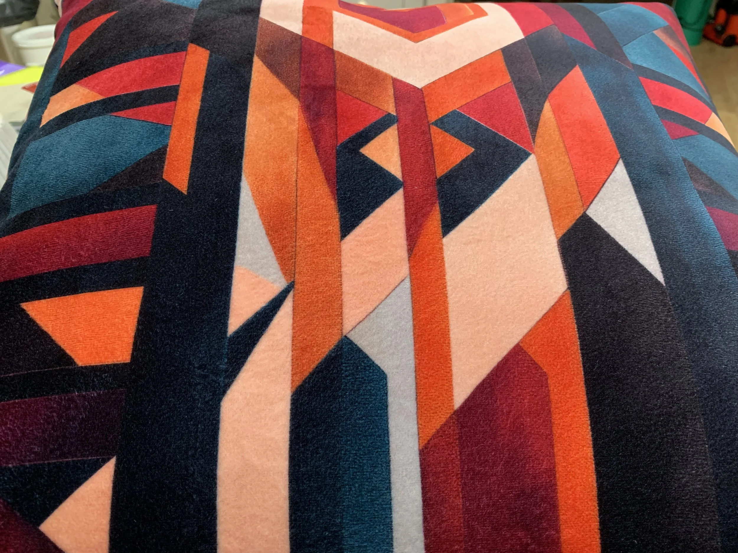 Geometric pattern pillow with vibrant colors