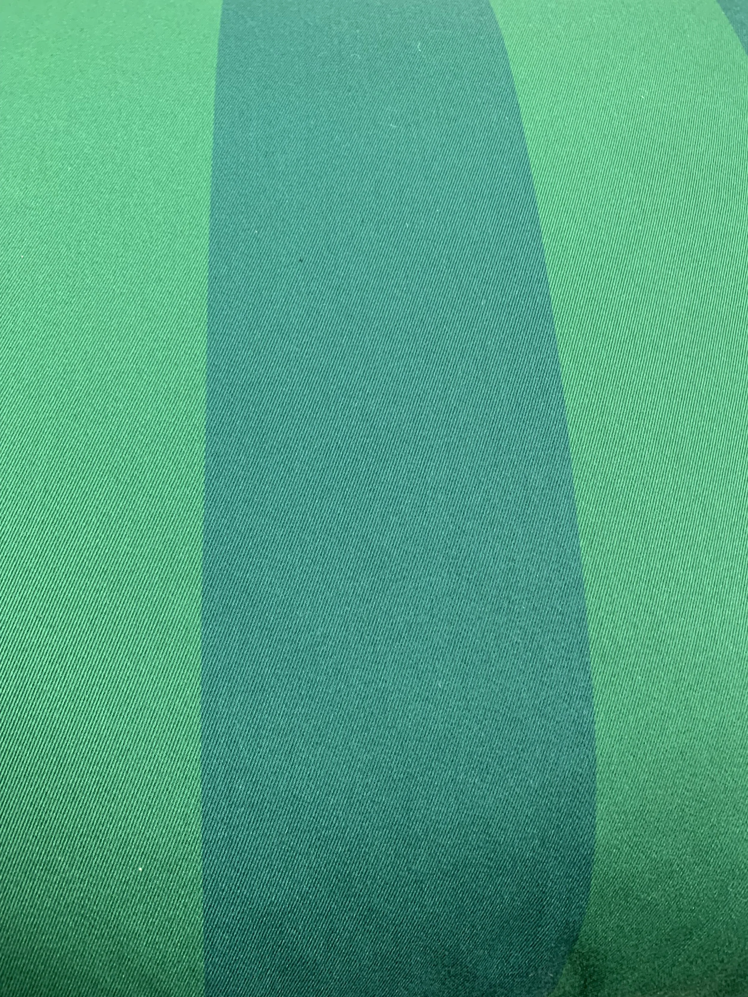 Close-up of green striped fabric texture