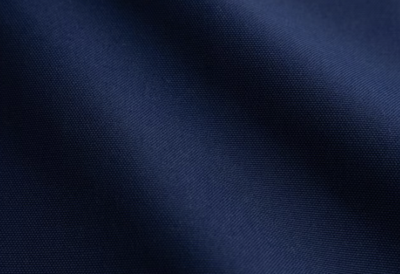 Close-up of dark blue fabric with a smooth texture