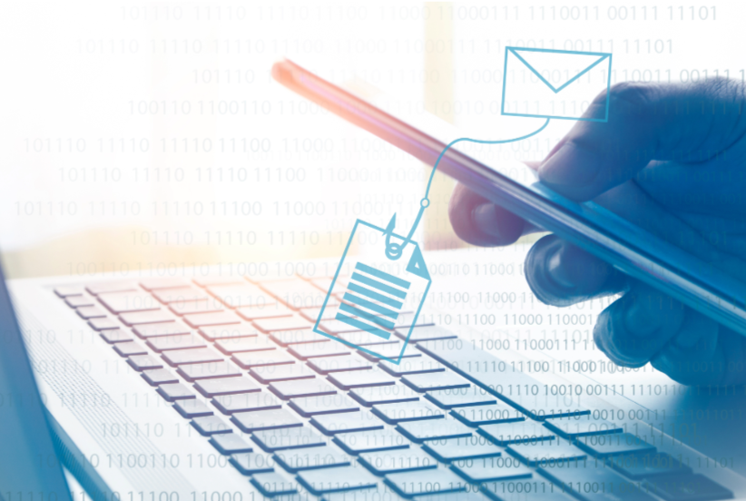 Close-up of a person's hand holding a pen over a keyboard, with digital icons of an email, a document, and a message bubble superimposed, representing digital communication and online work.