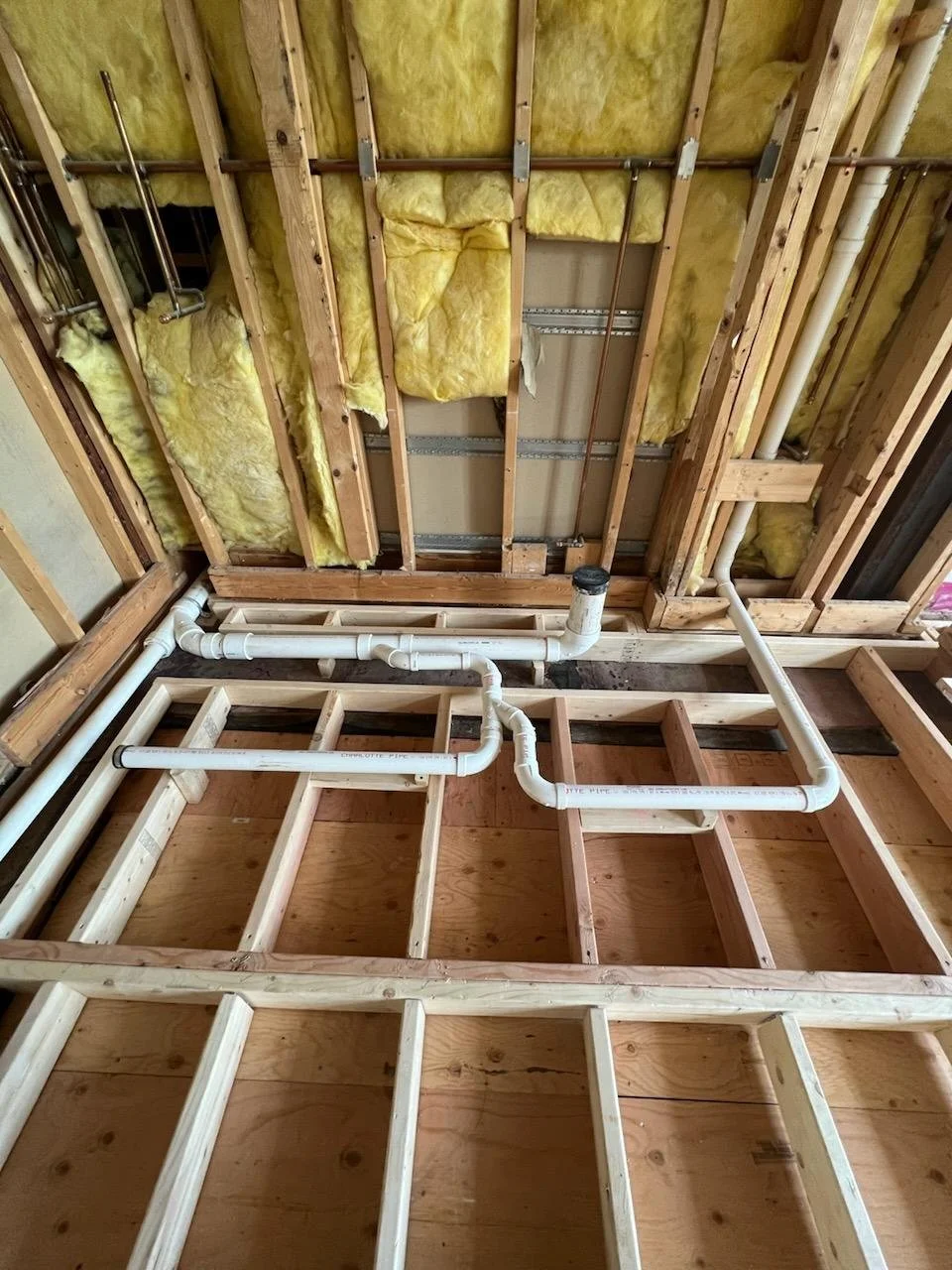 Plumbing rough drainage was installed prior to framing the second floor layer. The bathroom floor was intentionally raised to accommodate proper drainage and slope.
