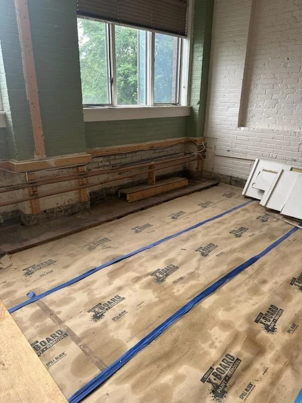 The unit was fully gutted to the original mill floor to assess existing conditions and prepare for structural upgrades.