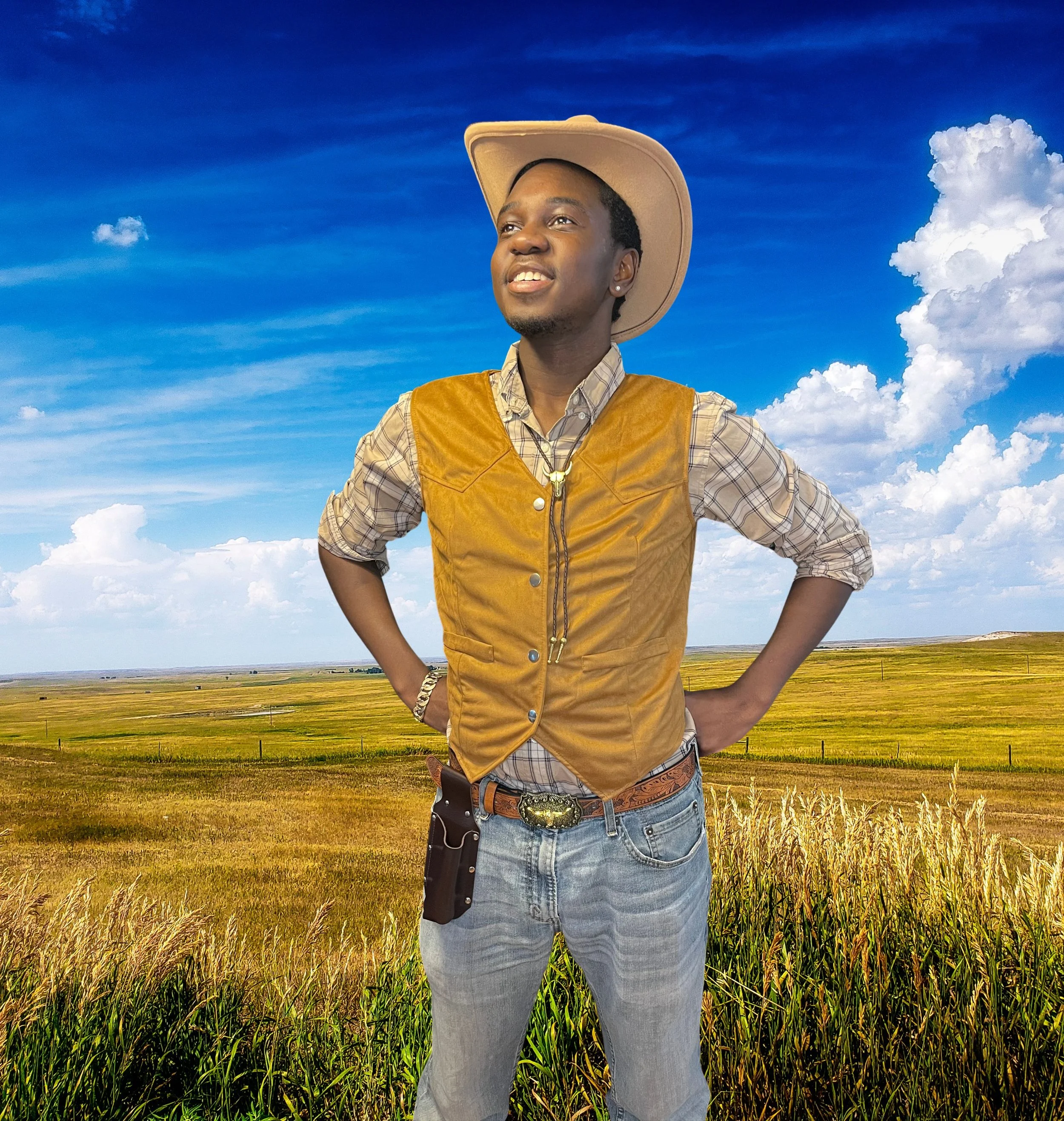 A man standing in a field of tall grass, wearing a cowboy hat, plaid shirt, jeans, and a brown vest, with a clear blue sky and scattered clouds in the background.