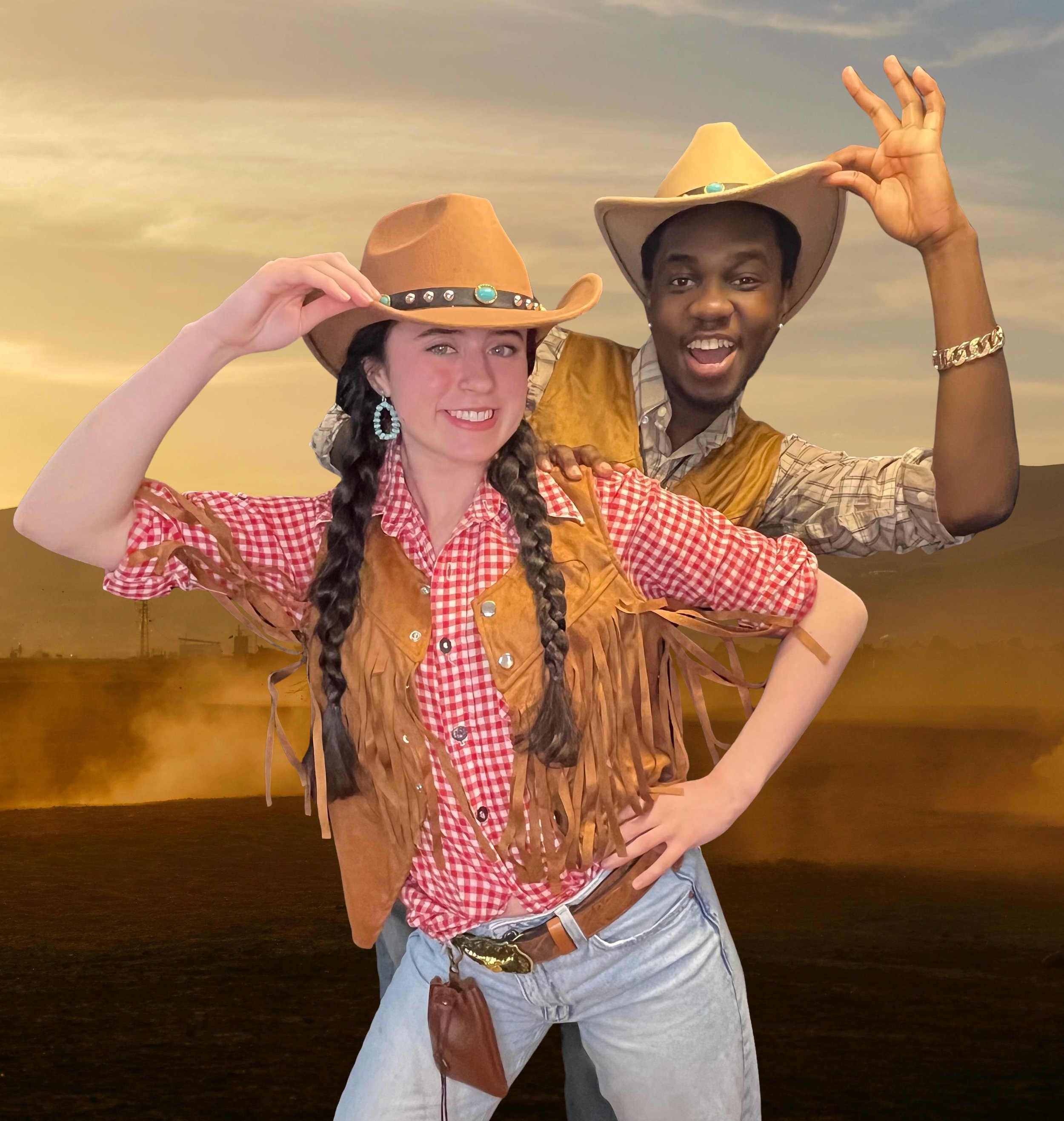 Two young adults dressed in cowboy-themed clothing, wearing cowboy hats and jewelry, posing outdoors during sunset.