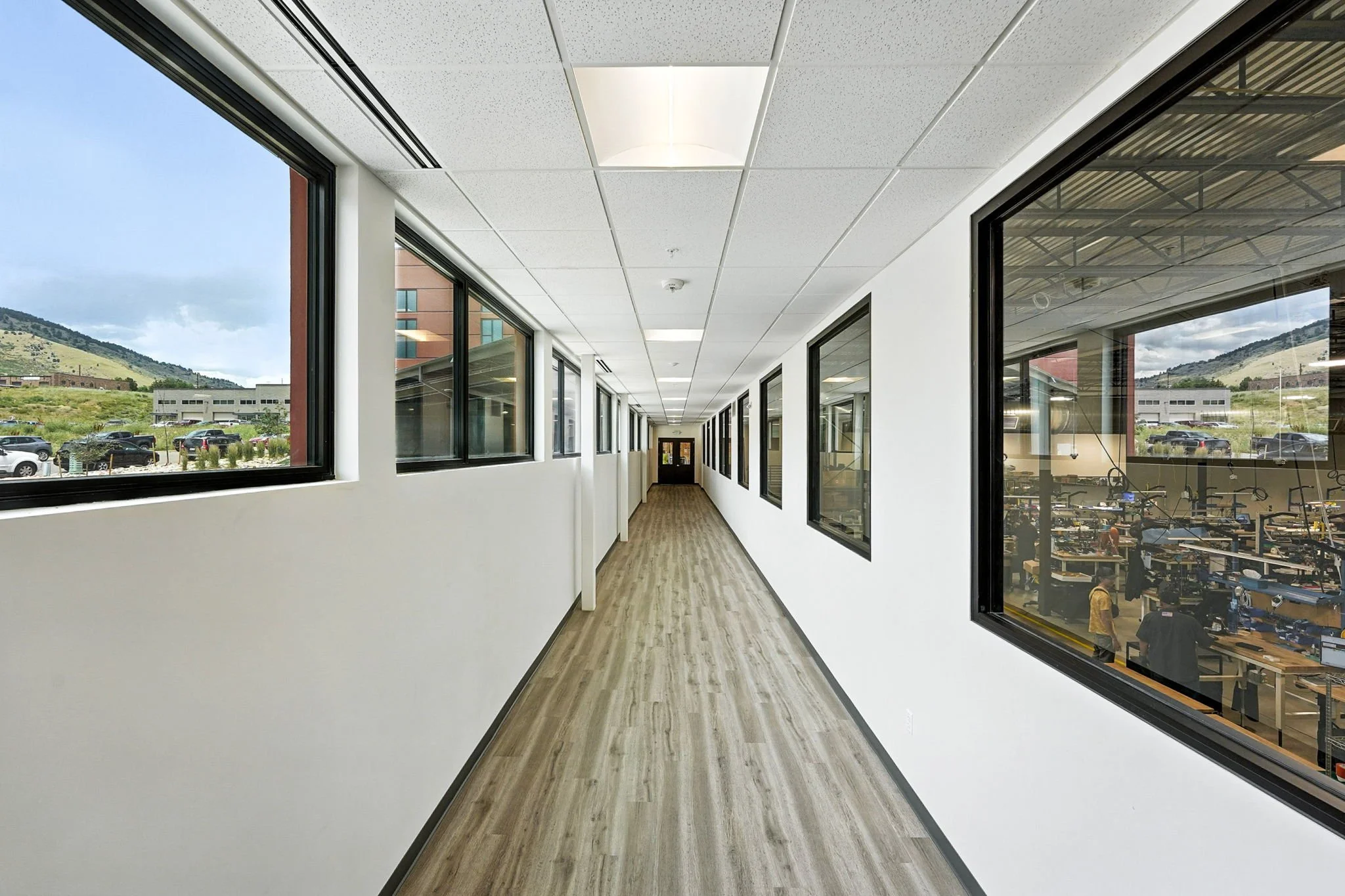 Natural light crosses the hallways to support with knife fabrication to the east.  The windows either side make for a beautiful hallway too!
