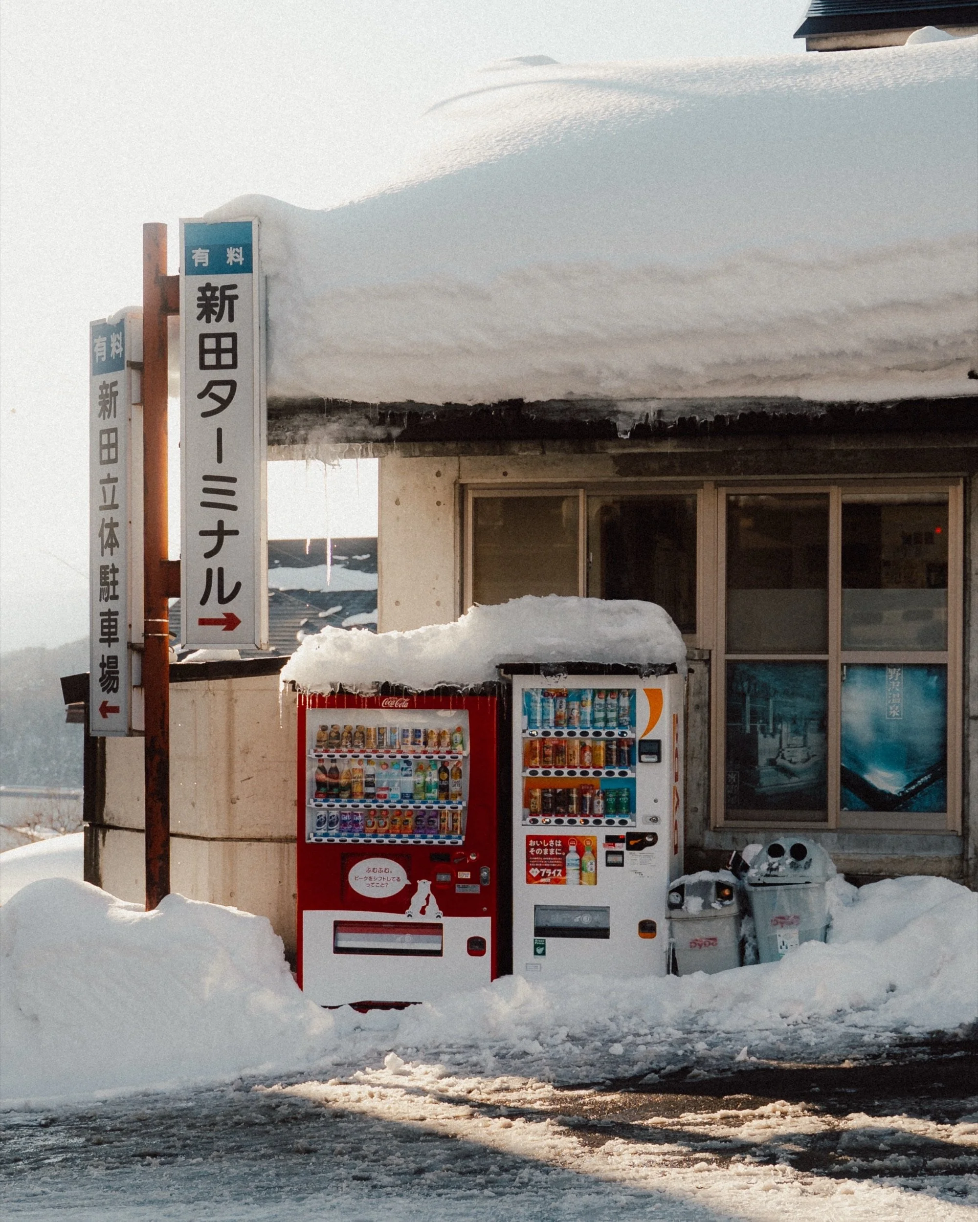 Snow-covered vending machines in Nozawa Onsen, Japan