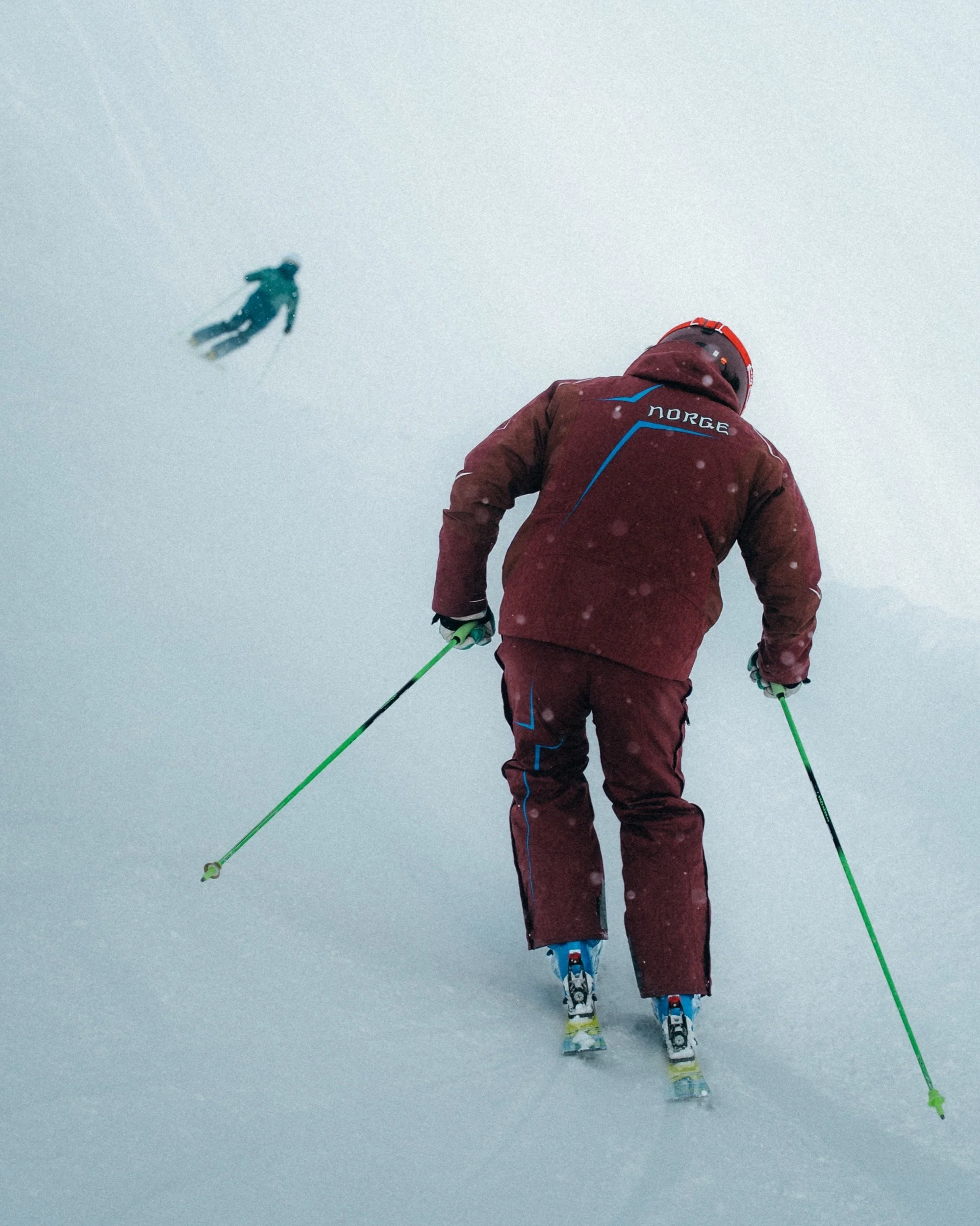 Shot while skiing as another skier flies through the frame, Kappl
