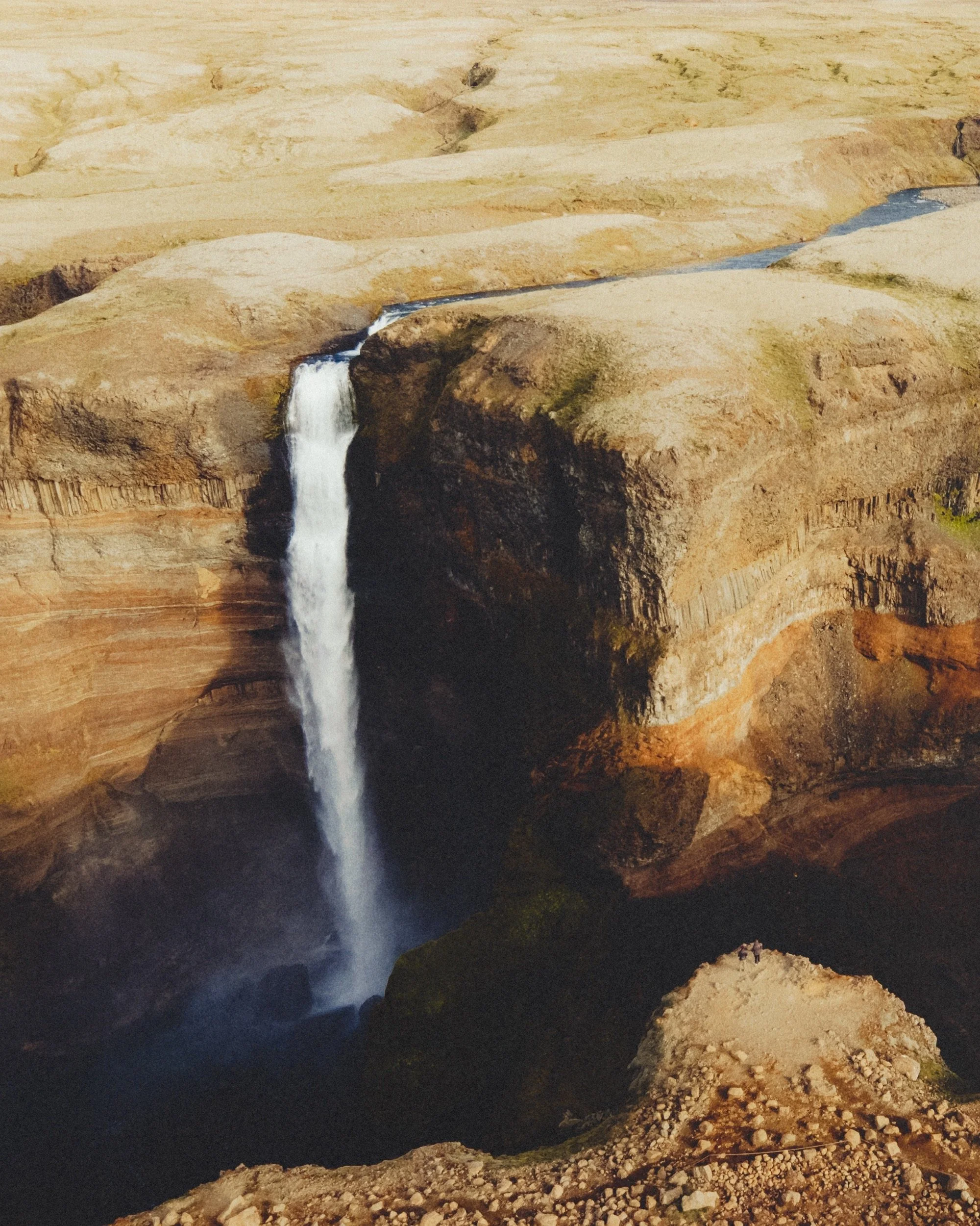 Aerial view of Háifoss waterfall with hikers below, Icelandic Highlands