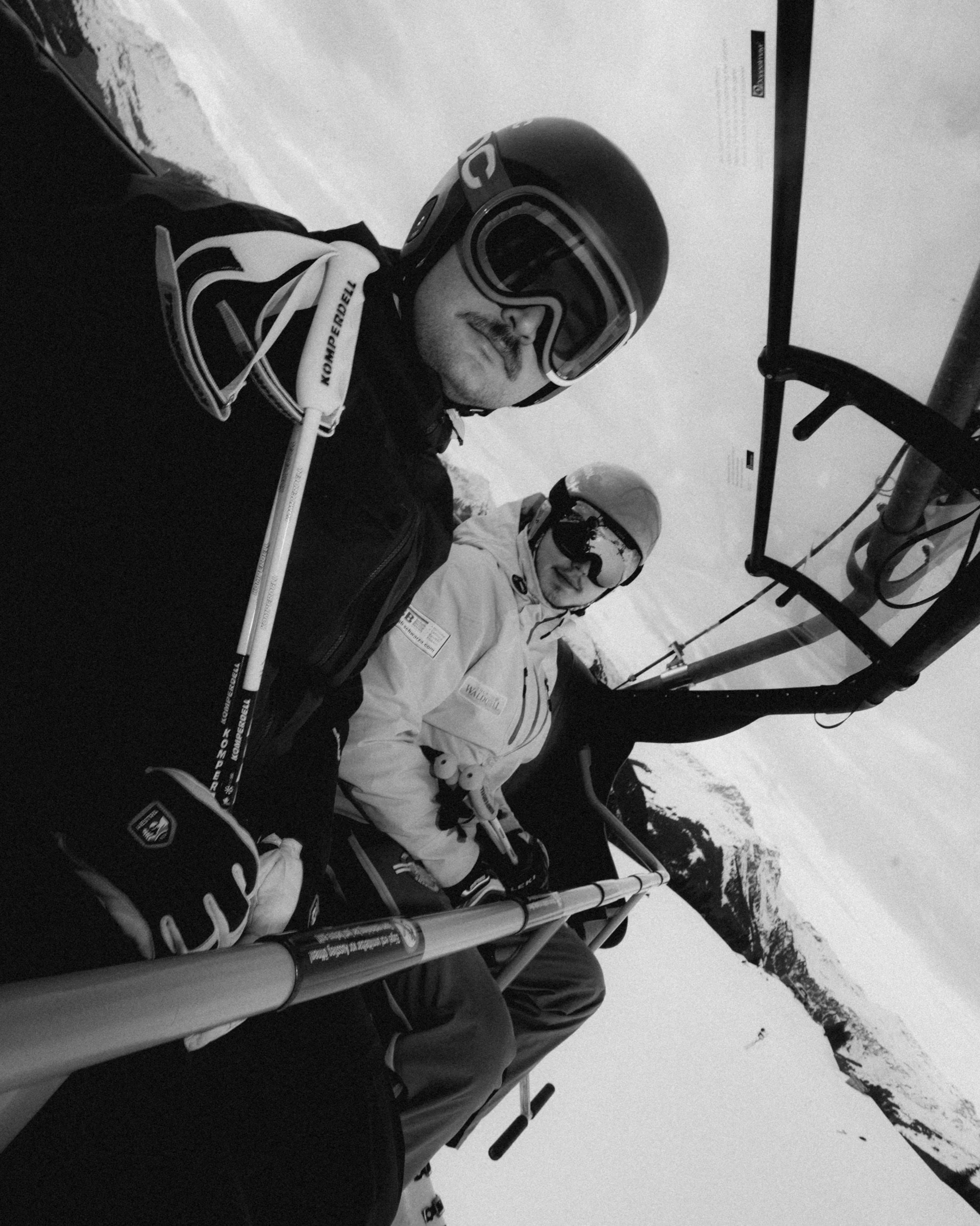 Two skiers on the chairlift, Saalbach. Flash photography