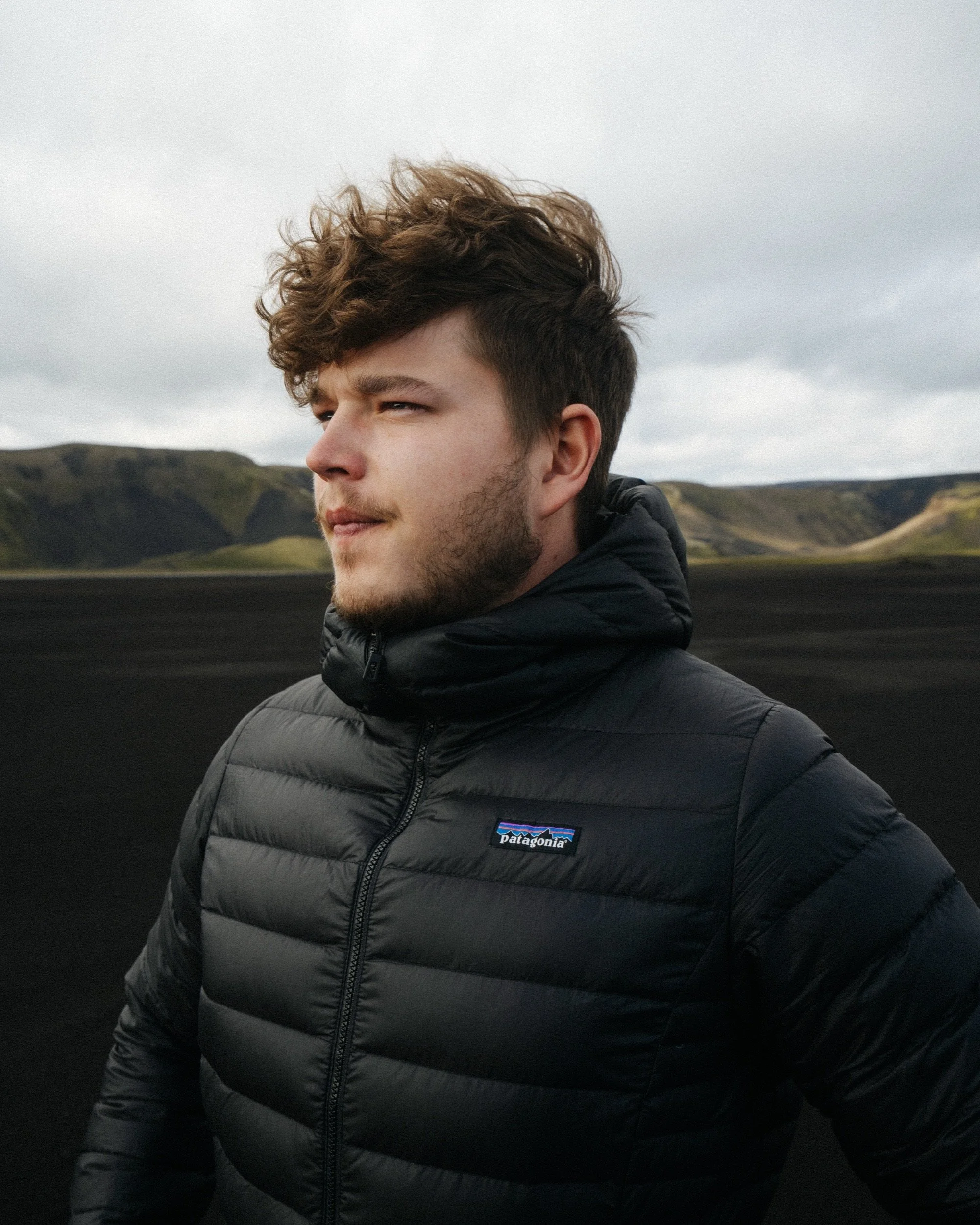Portrait in a Patagonia down jacket in the Icelandic Highlands