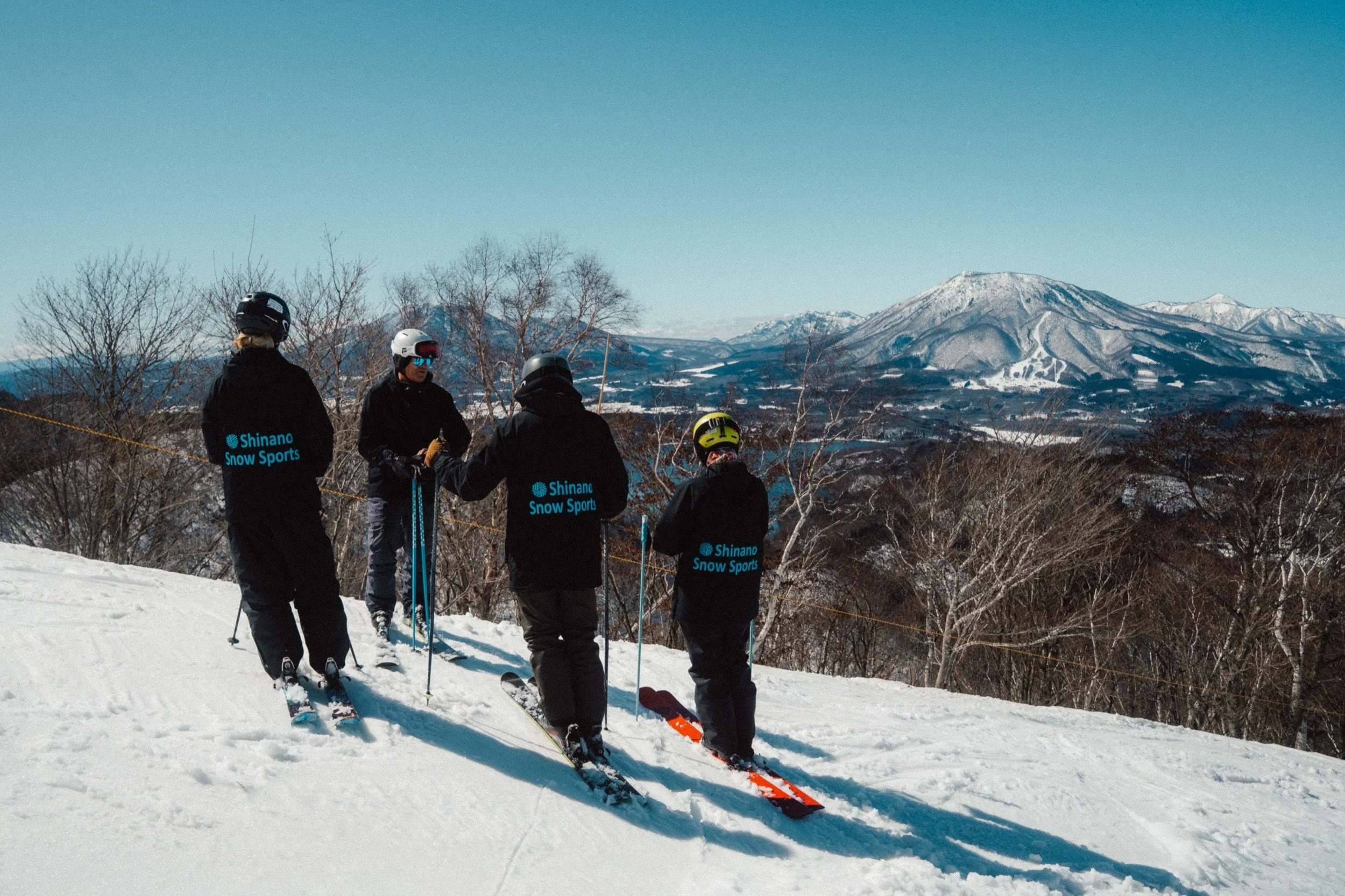 Shinano Snow Sports ski school at Tangram Madarao, with a view of Mount Myoko, Japan
