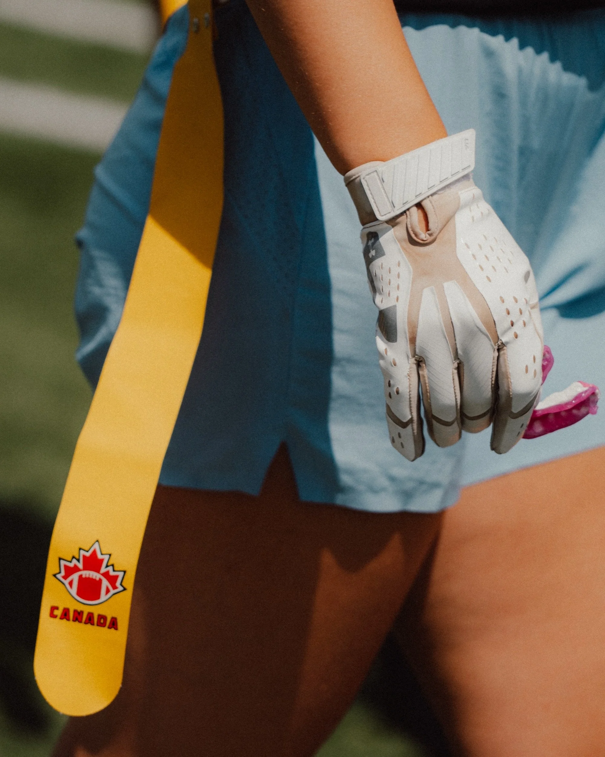Flag football player holding her mouthguard, Charlevoix vs. Flag Queens, Québec, Canada