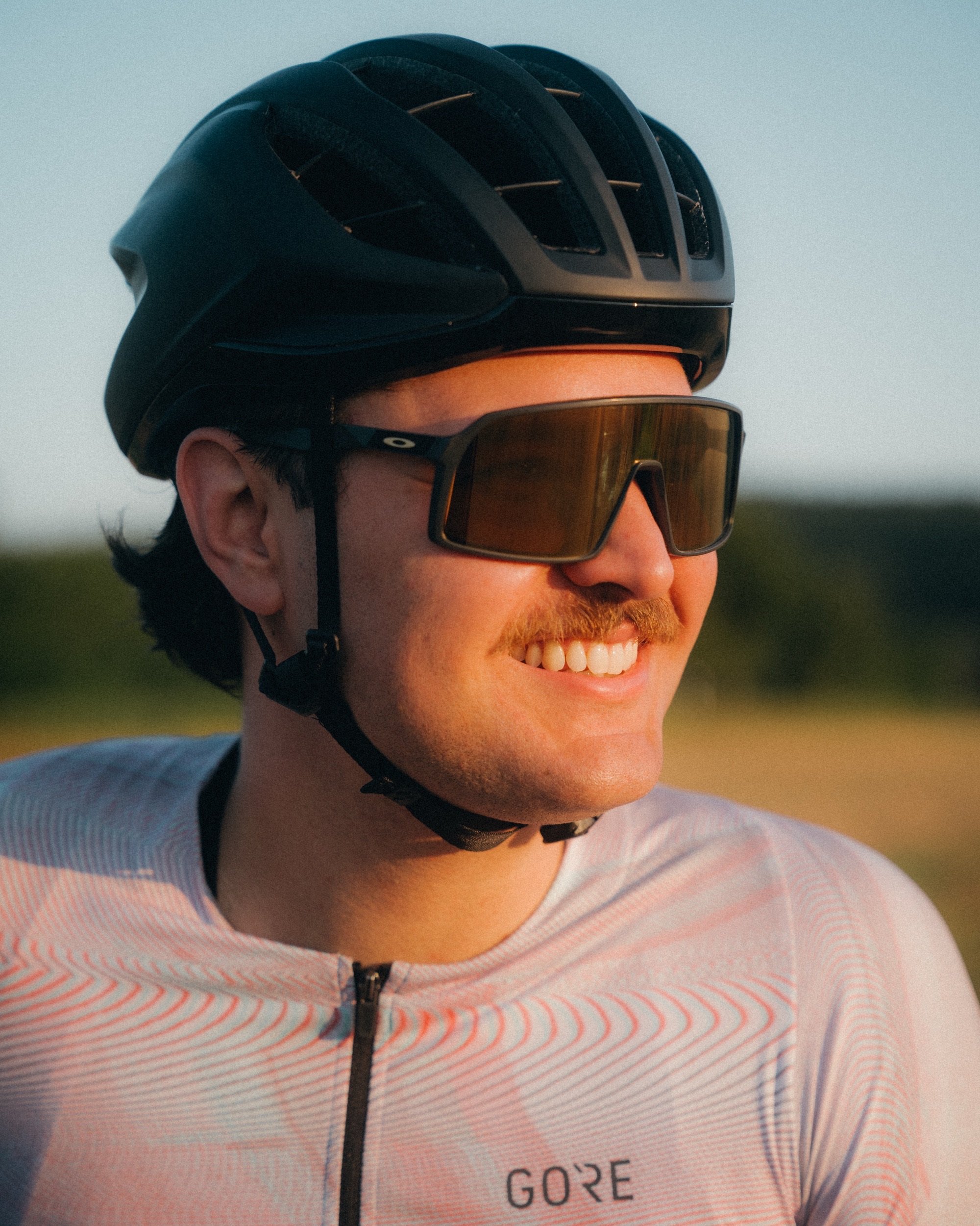 Cyclist portrait at sunrise in Oakley sunglasses and a Gore jersey, Thuringian Forest, Germany