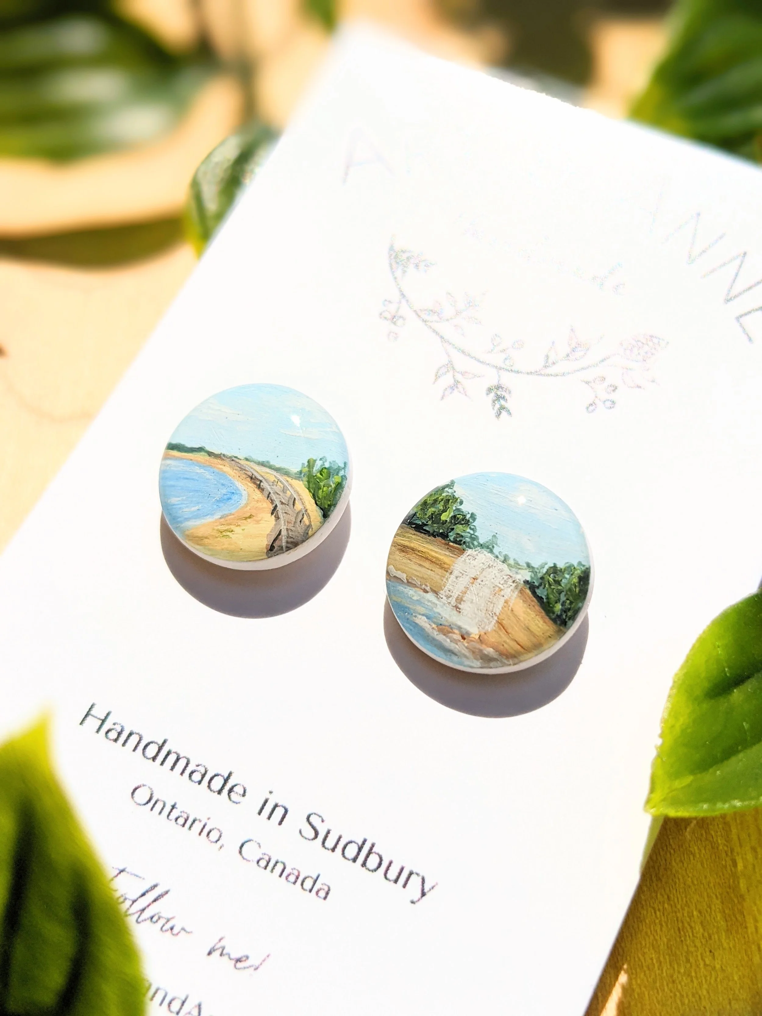 Custom hand-painted stud earrings featuring Providence Bay and Bridal Veil Falls, Manitoulin Island (2022)