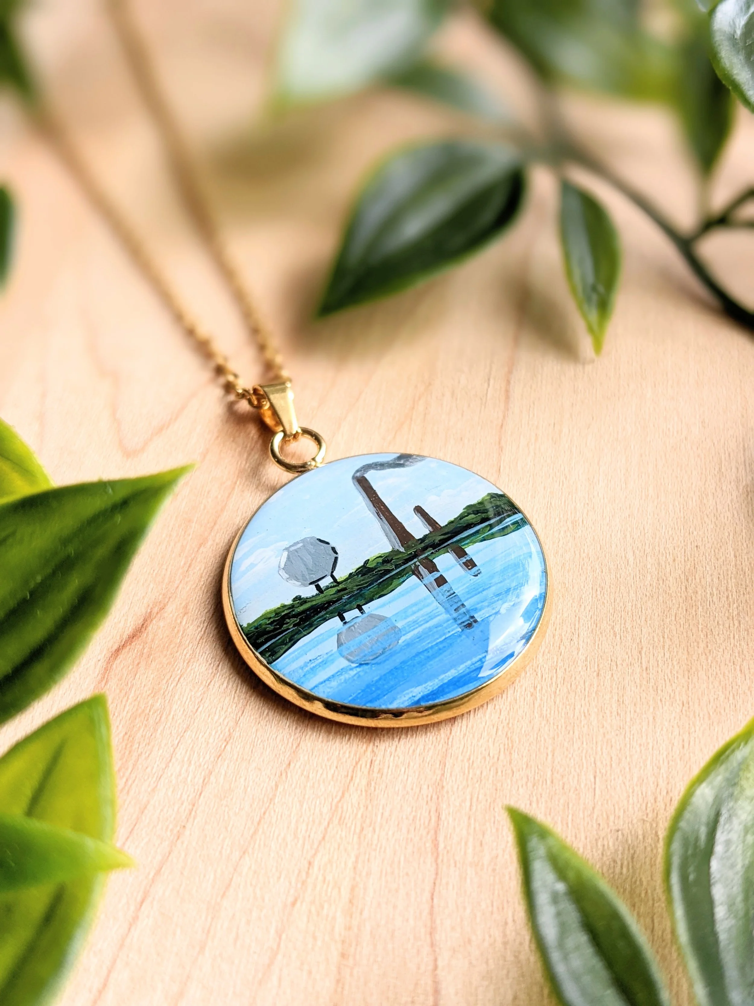 Custom hand-painted necklace featuring Sudbury Ontario landmarks, Sudbury smokestack and the Big Nickel