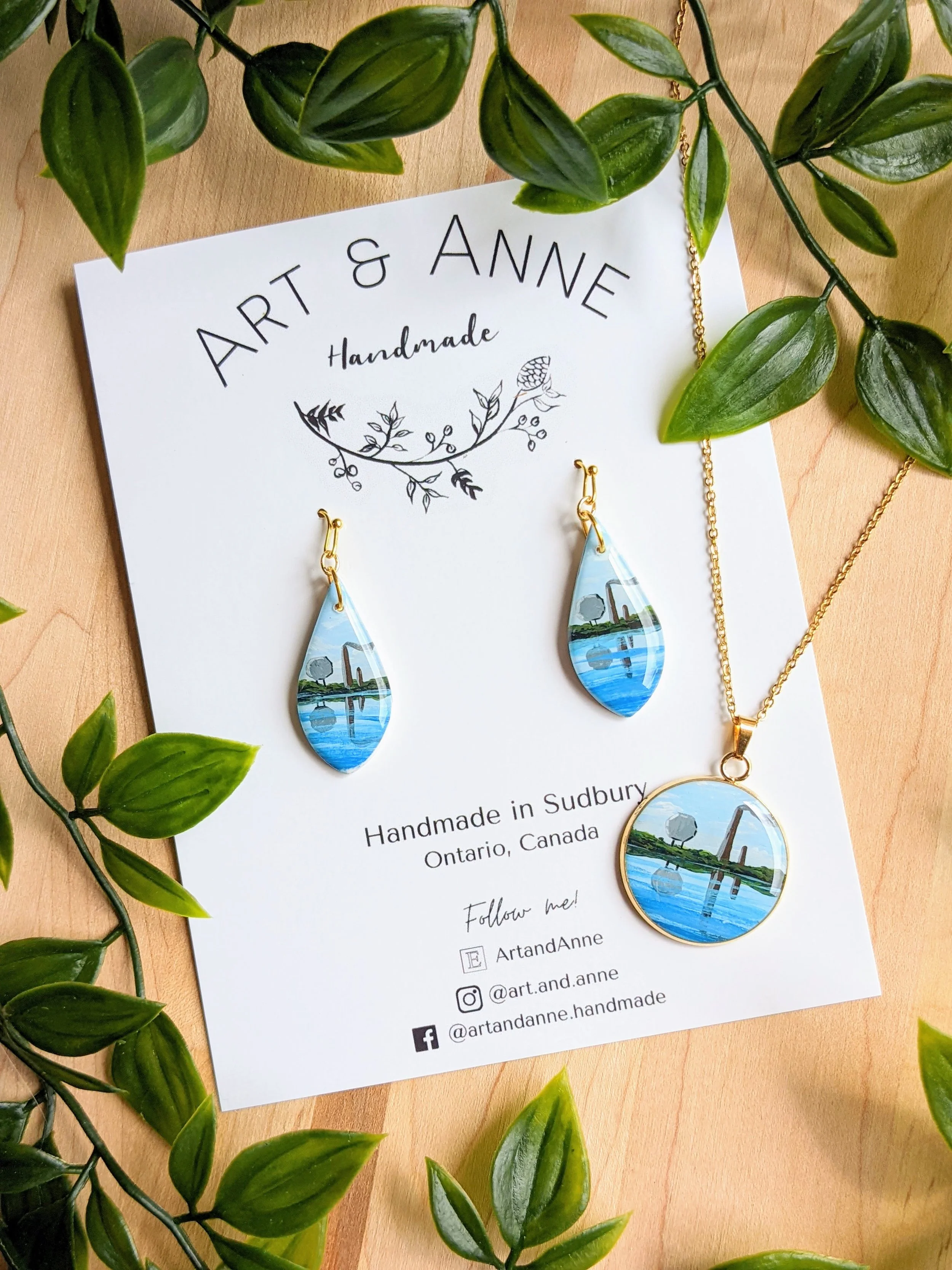 Custom hand-painted earring and necklace set featuring the Sudbury smokestack and Big Nickel (2022)