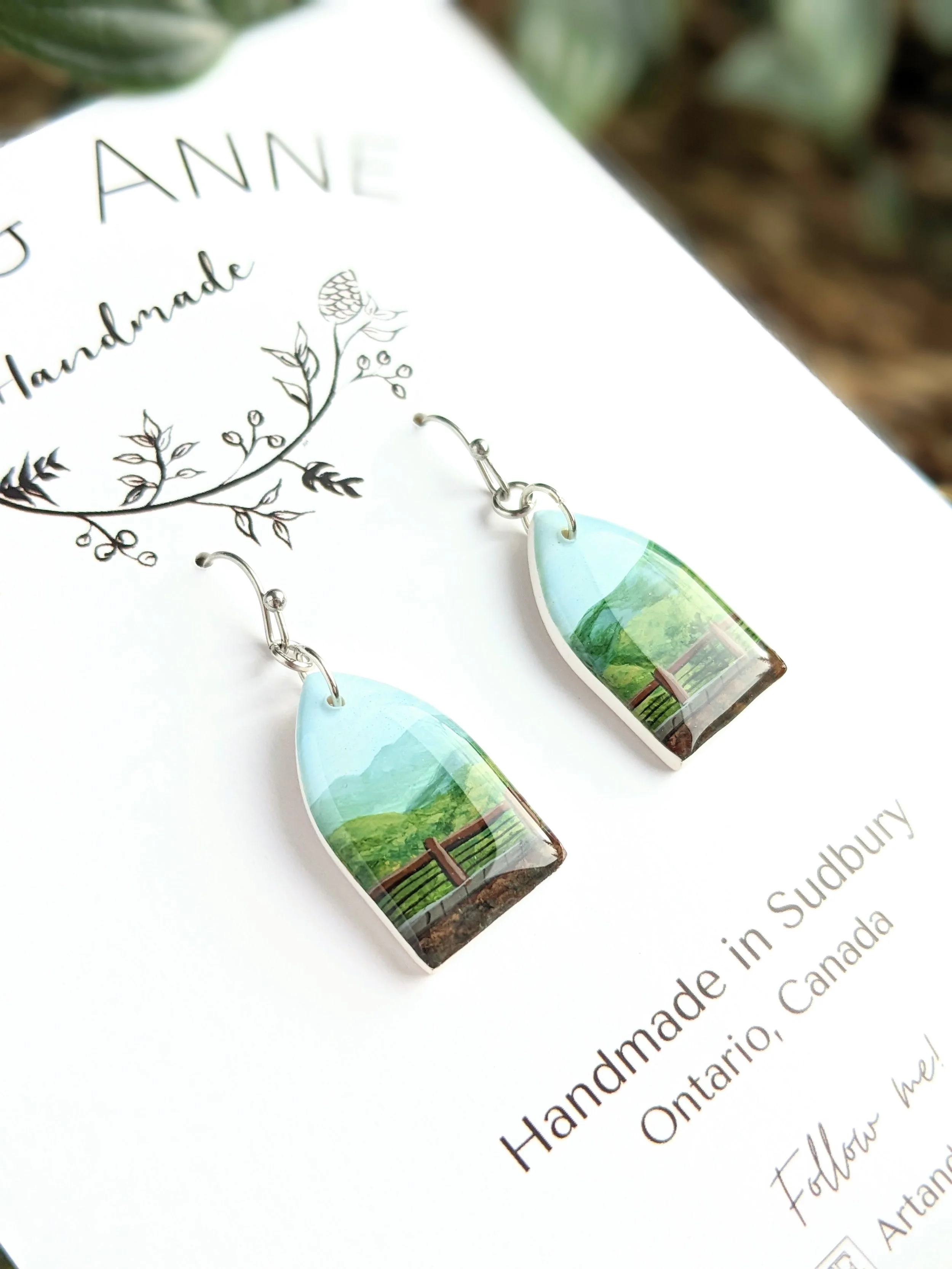 Custom hand-painted earrings featuring a wedding venue (2023)
