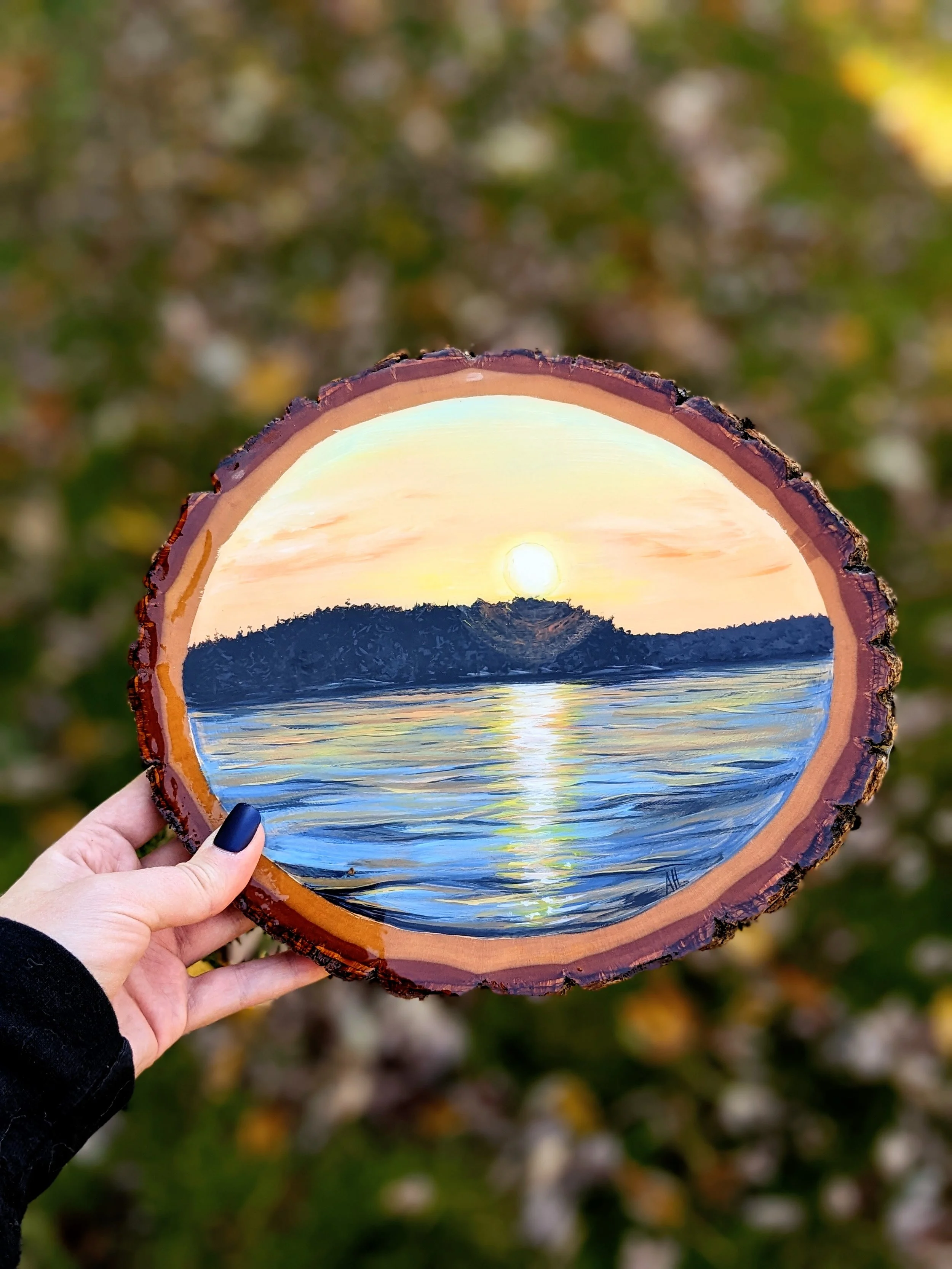Custom acrylic painting of Long Lake in Sudbury on a round wood slice (2022)