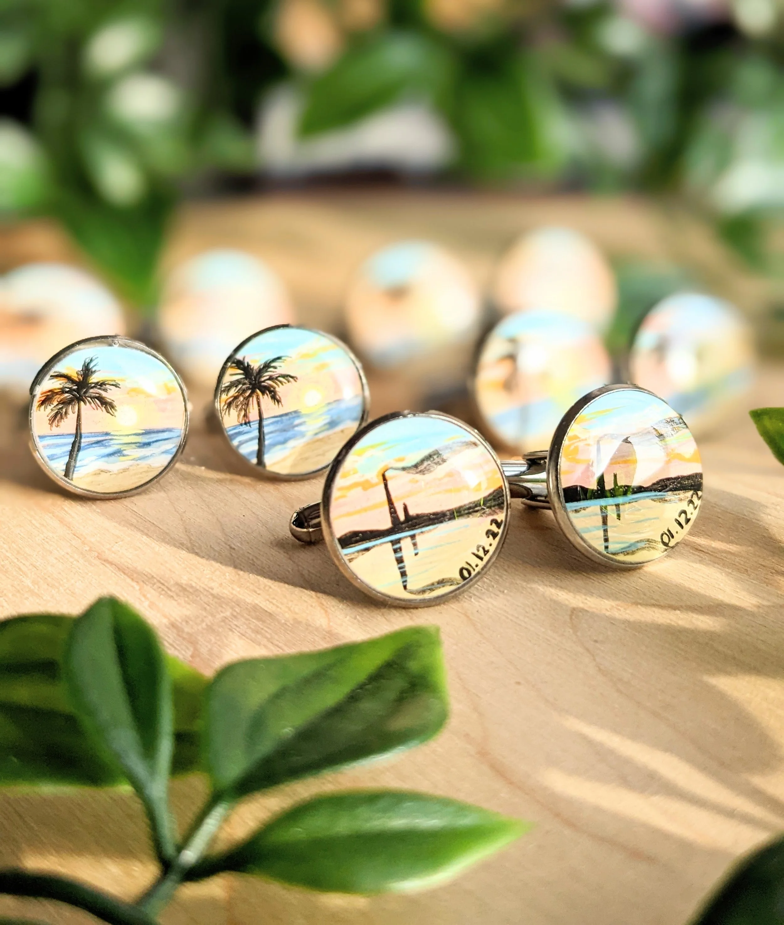 Custom hand-painted cufflinks featuring palm trees and the Sudbury smokestack for wedding party favors (2022)