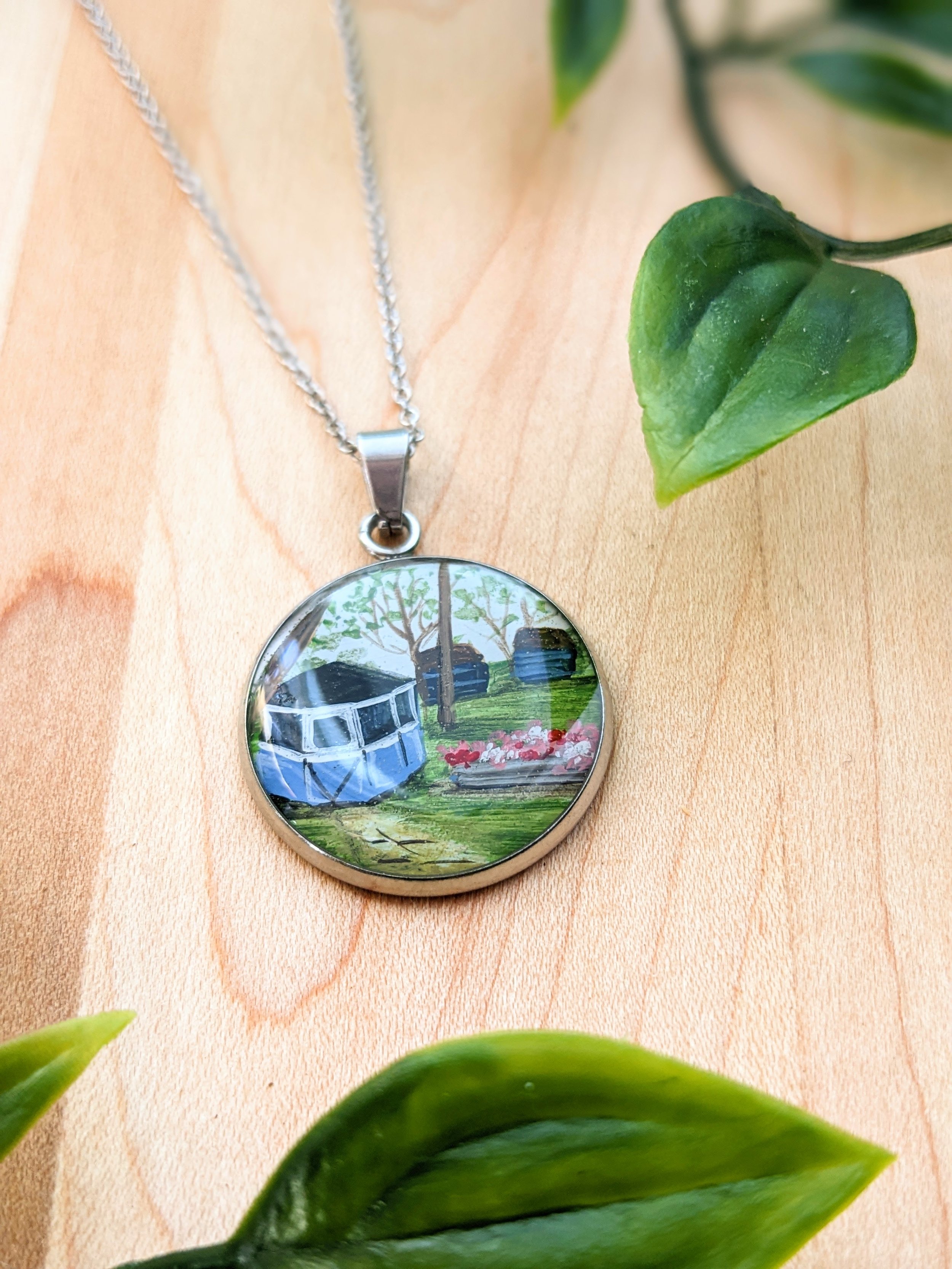 Custom hand-painted necklace featuring a back yard gazebo (2022)