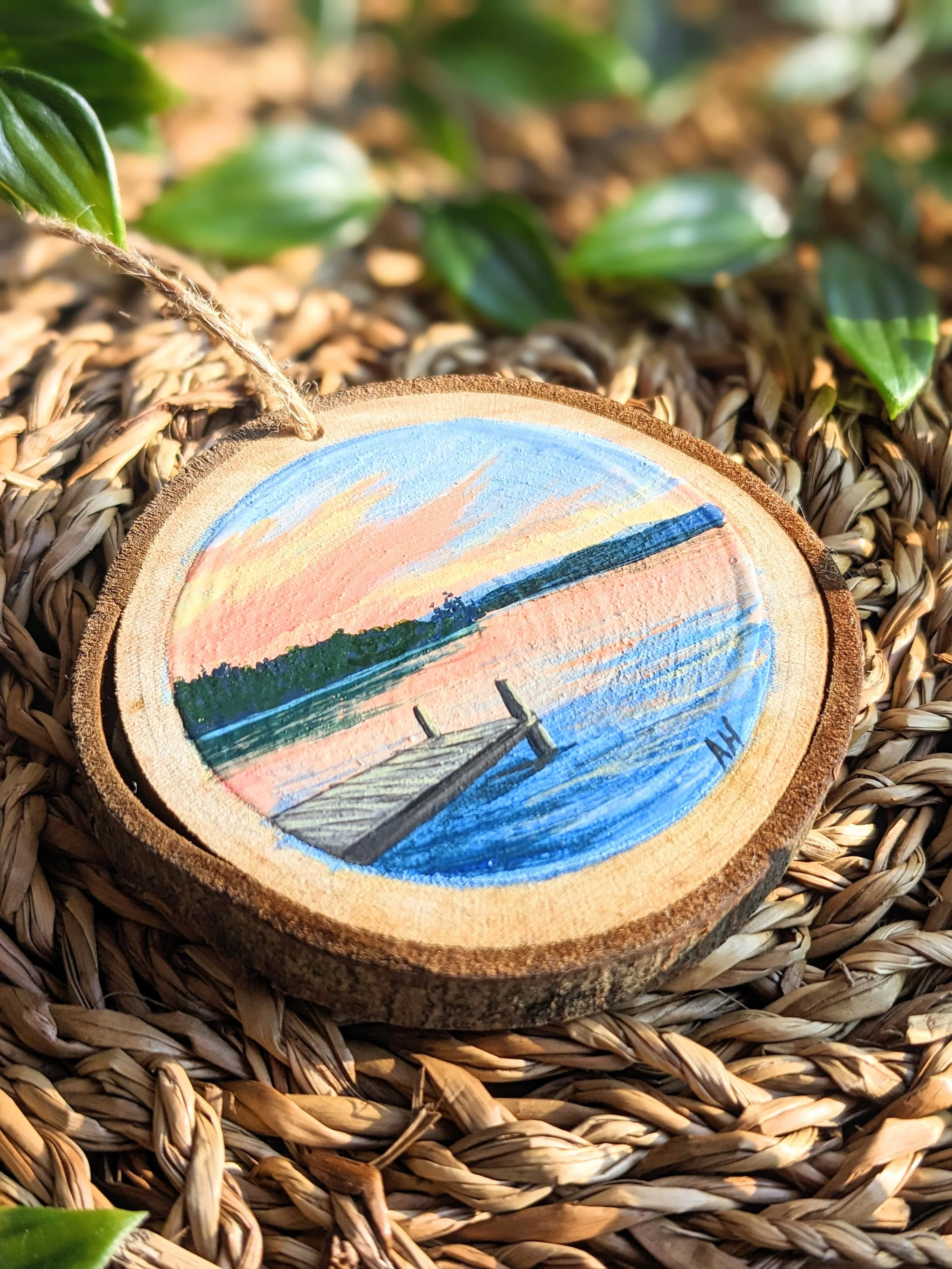 Custom hand-painted Christmas ornament featuring a dock at sunset (2022)