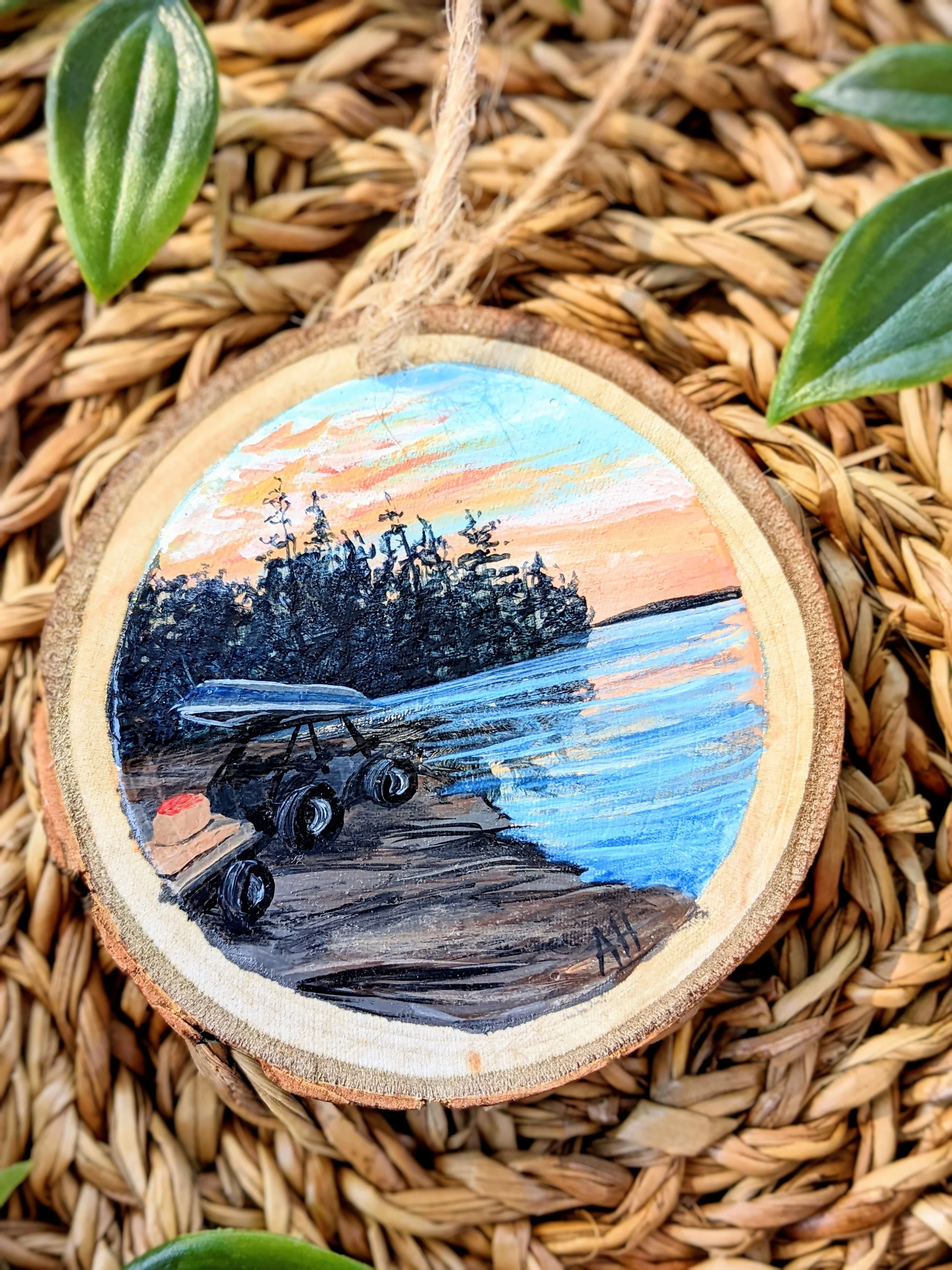 Custom hand-painted Christmas ornament featuring an ATV along a lakeshore (2022)
