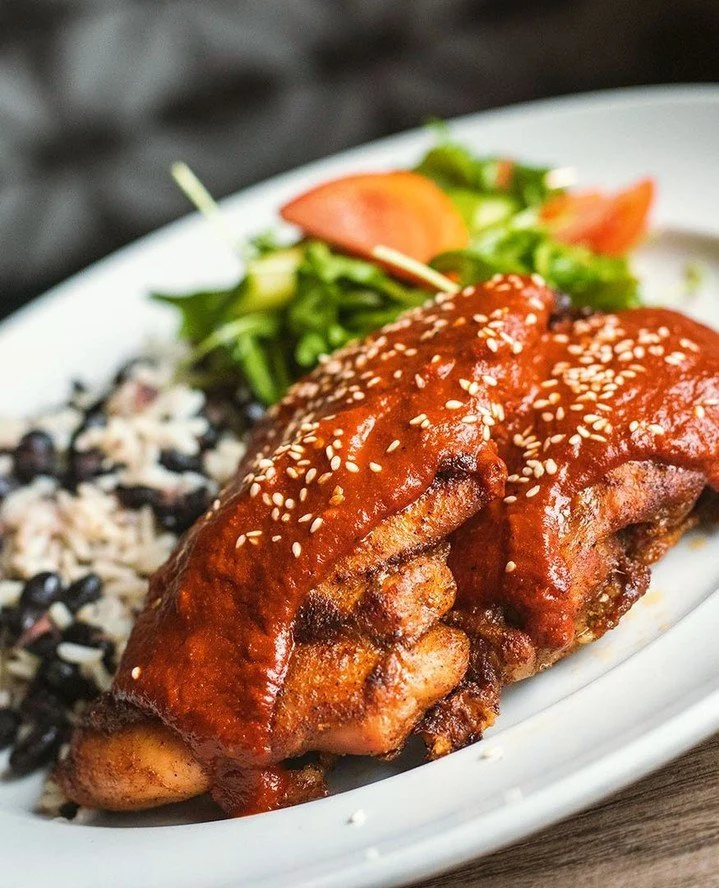 Mole mole mole mole mole! ⁠
⁠
Sorry...we get very excited when chef makes his secret mole chicken &ndash; tender chicken thighs, white rice, black beans, classic mole (contains nuts), and dressed arugula.⁠
⁠
Available tonight while it lasts!