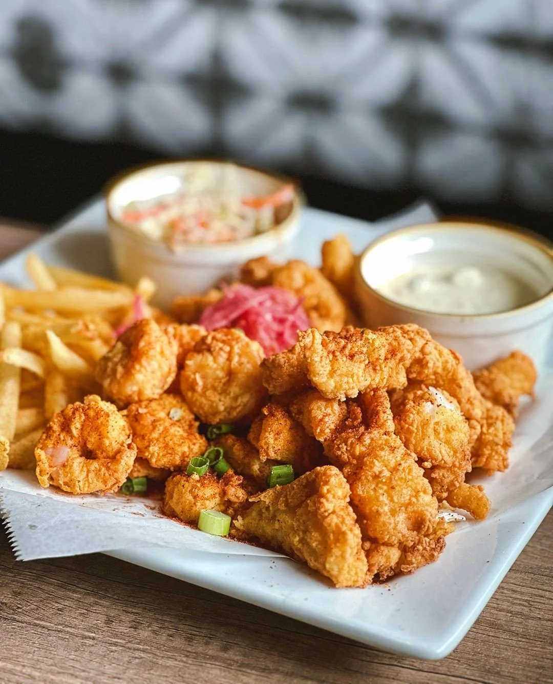 Chef Special on the Board 🎣 Mexican Fisherman&rsquo;s Platter with chili cumin spiced fried haddock, calamari and shrimp with fries, habanero slaw, and avocado tartar sauce.⁠
⁠
Available this week only!